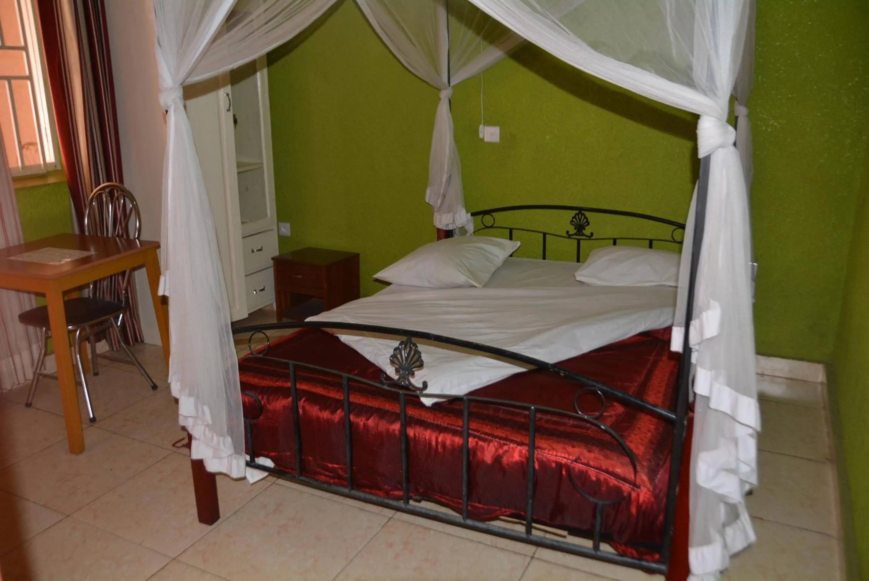 Bed in La Voisina Hotel