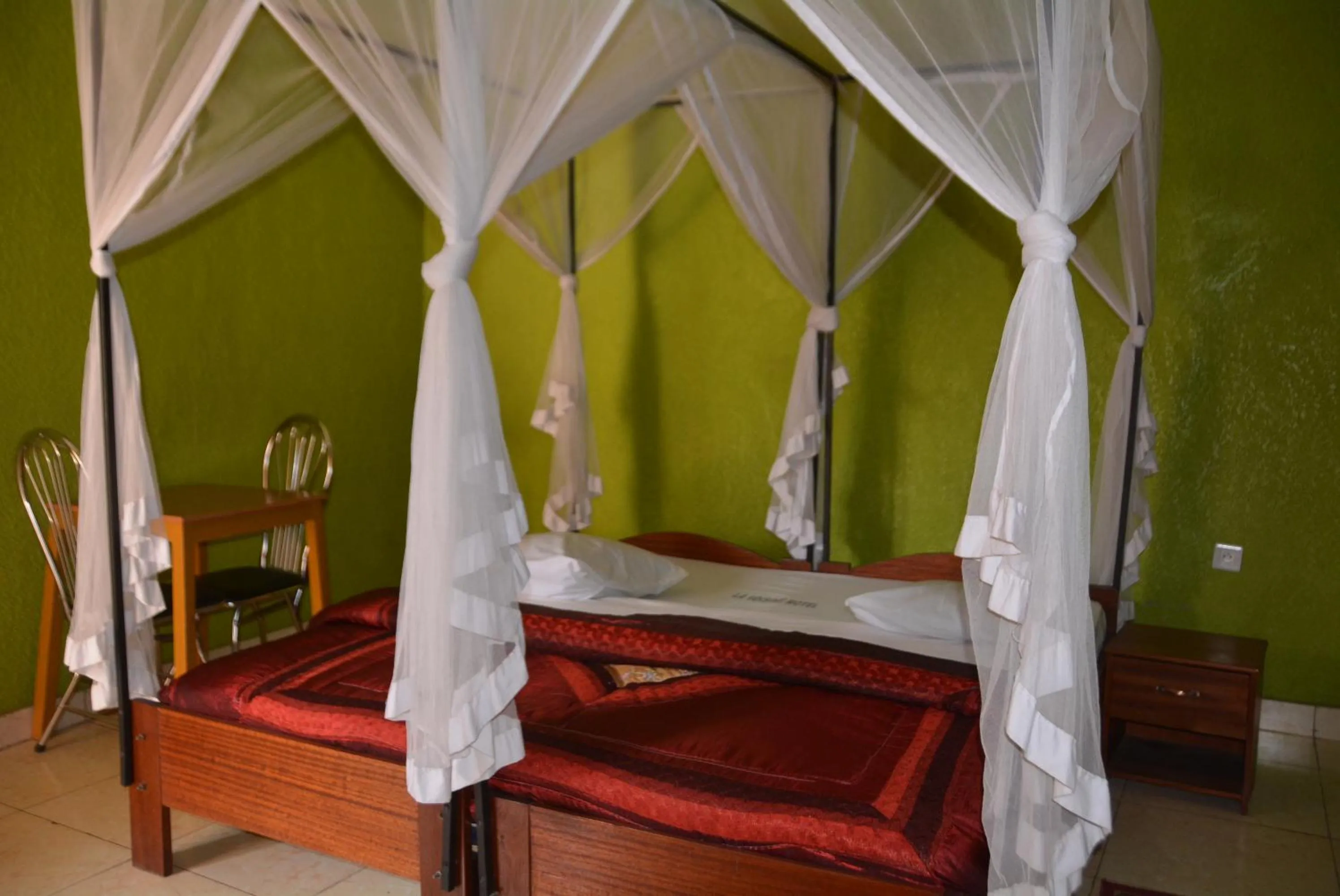 Bed in La Voisina Hotel