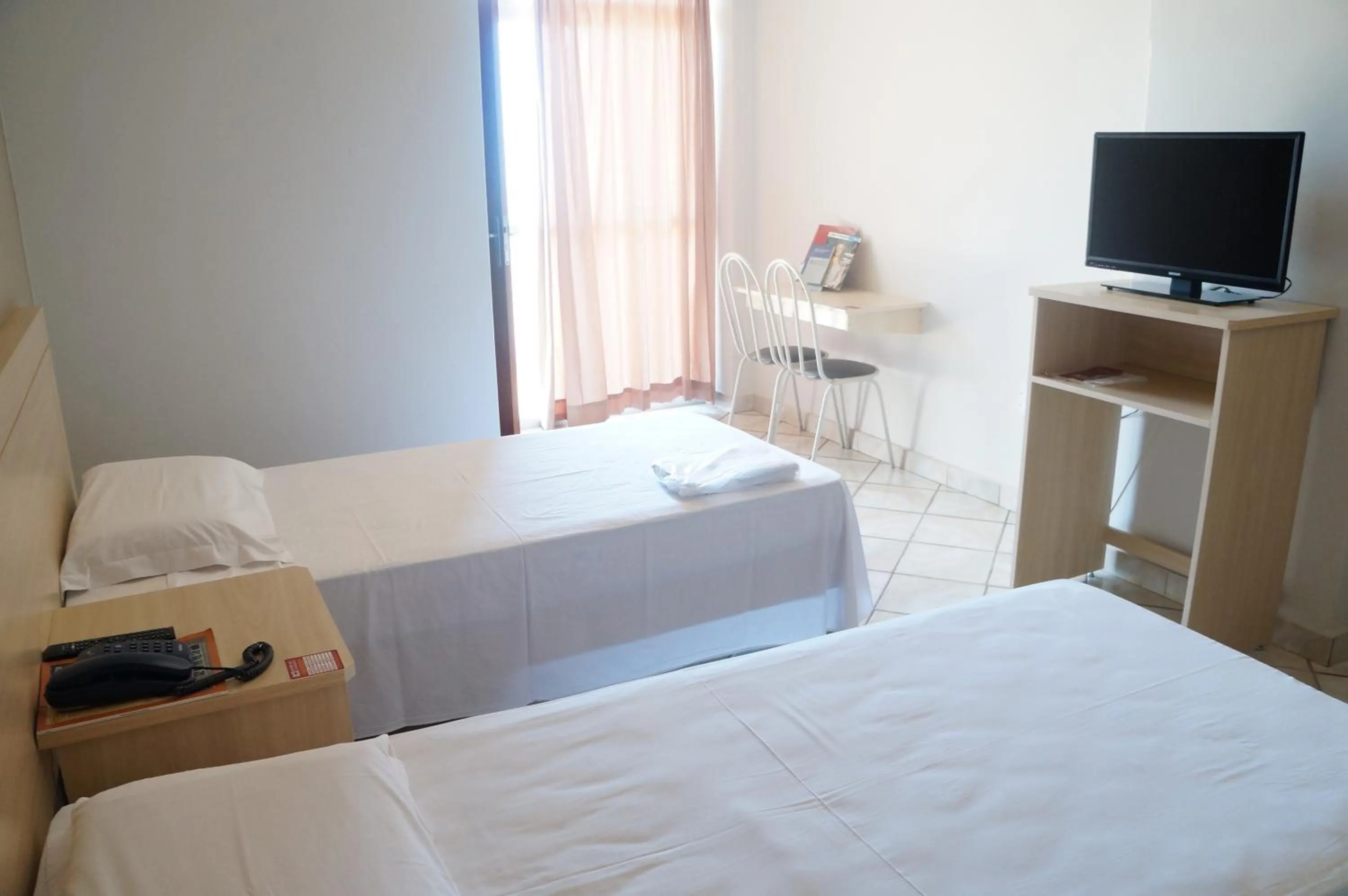 Bed in Manhuaçu Center Hotel