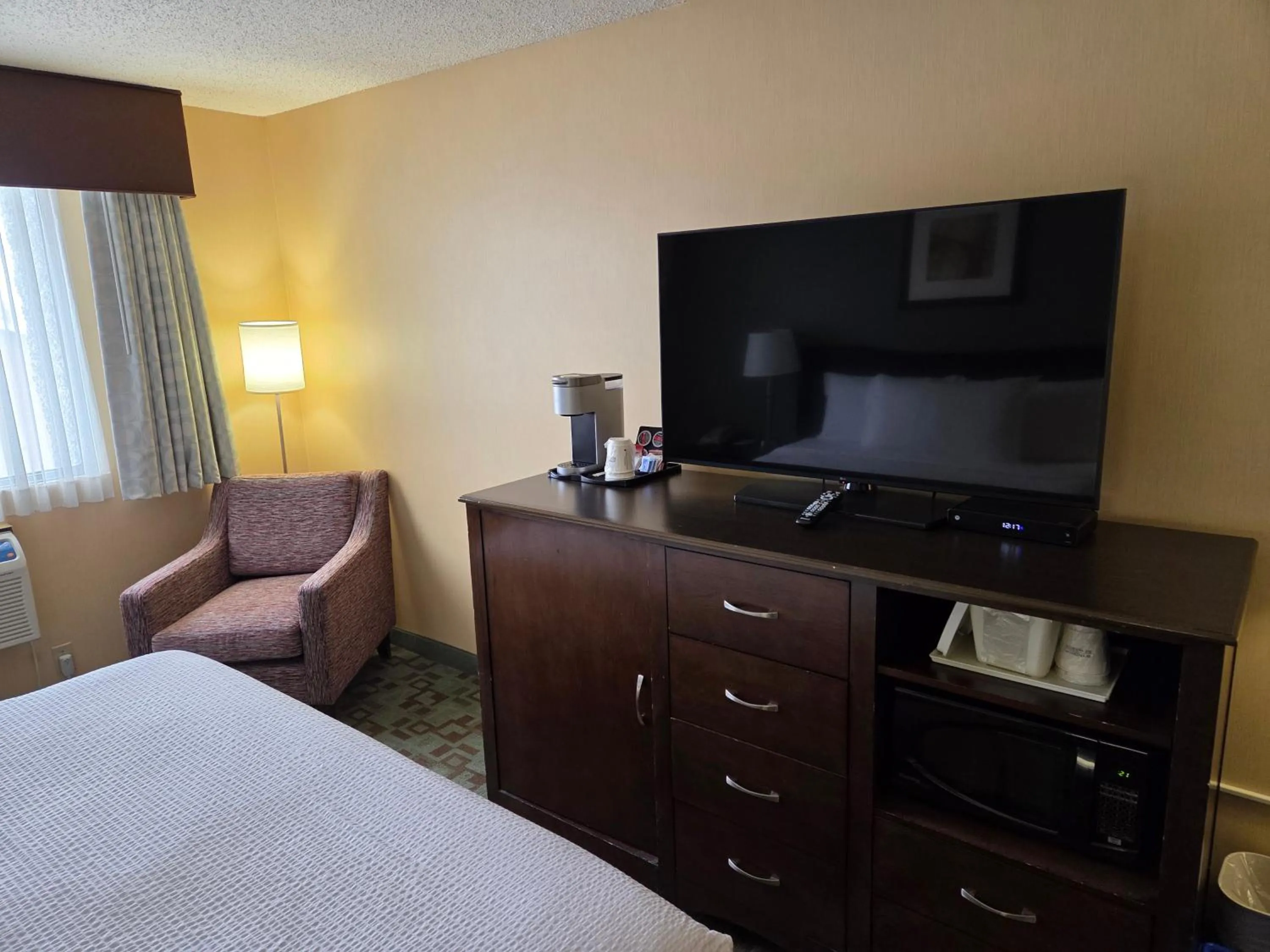 Photo of the whole room, Bed in Ramada by Wyndham Saskatoon