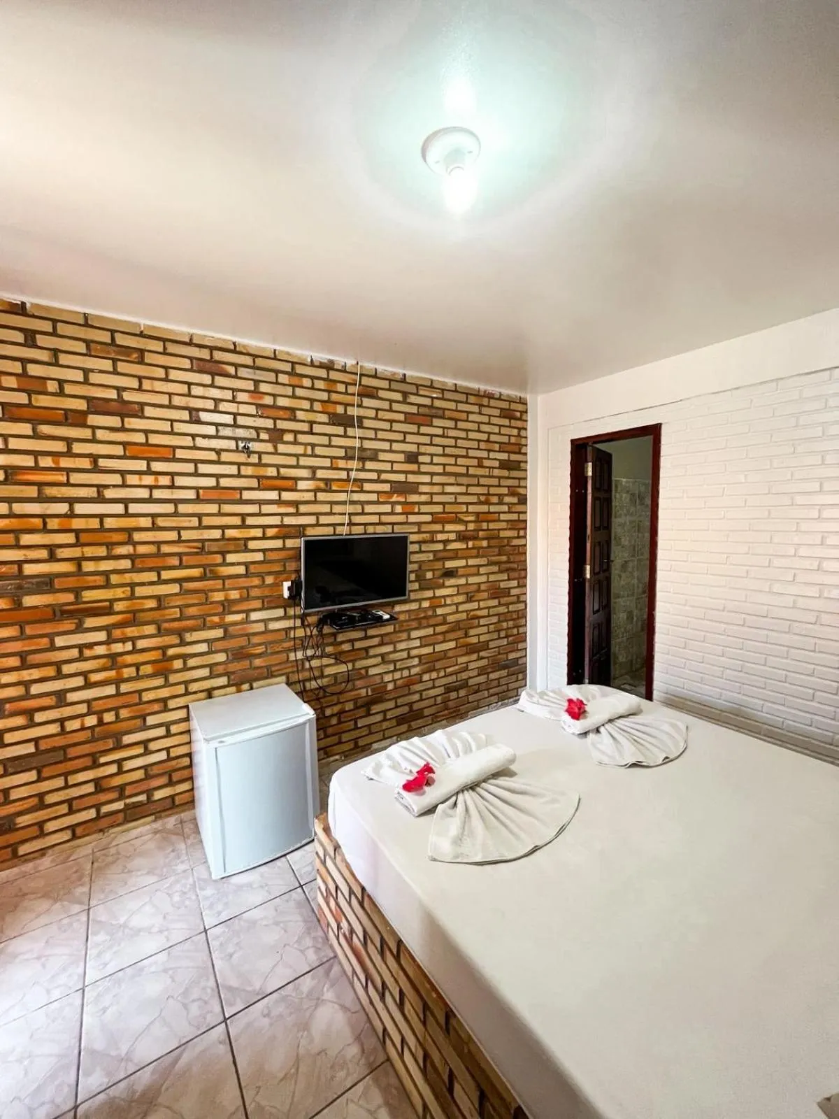 Bed in Pousada La Goduria