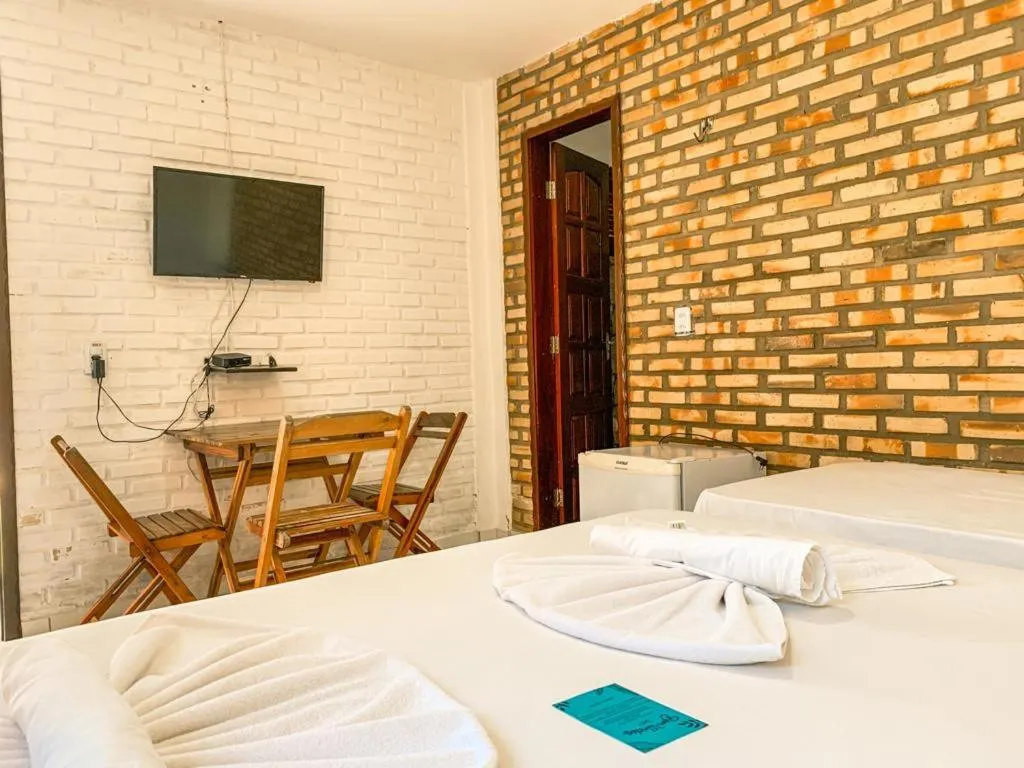 Bed in Pousada La Goduria