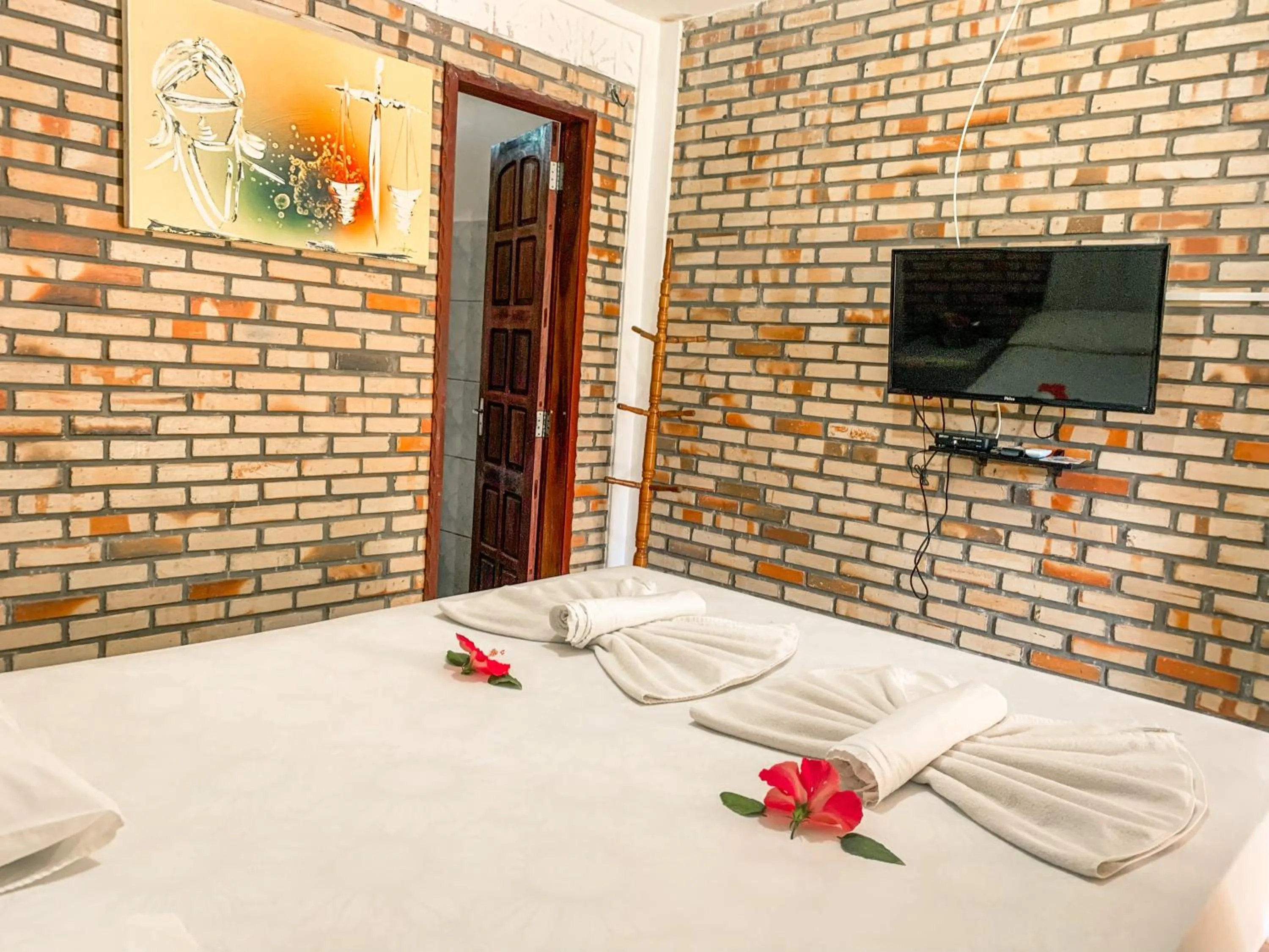 Bed in Pousada La Goduria