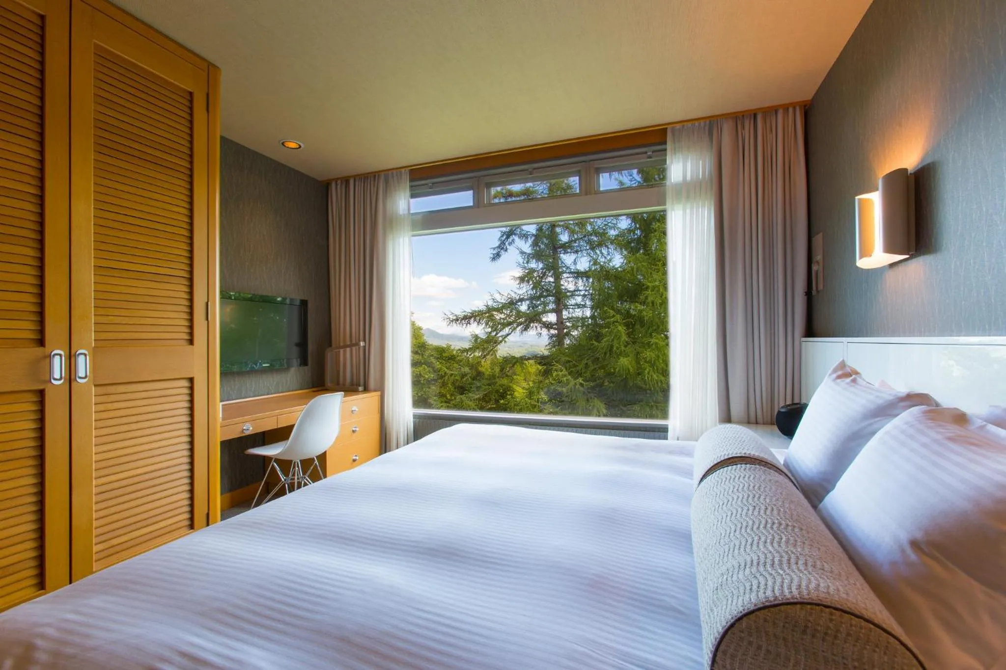 Bed in The Green Leaf Niseko Village, Tapestry Collection by Hilton