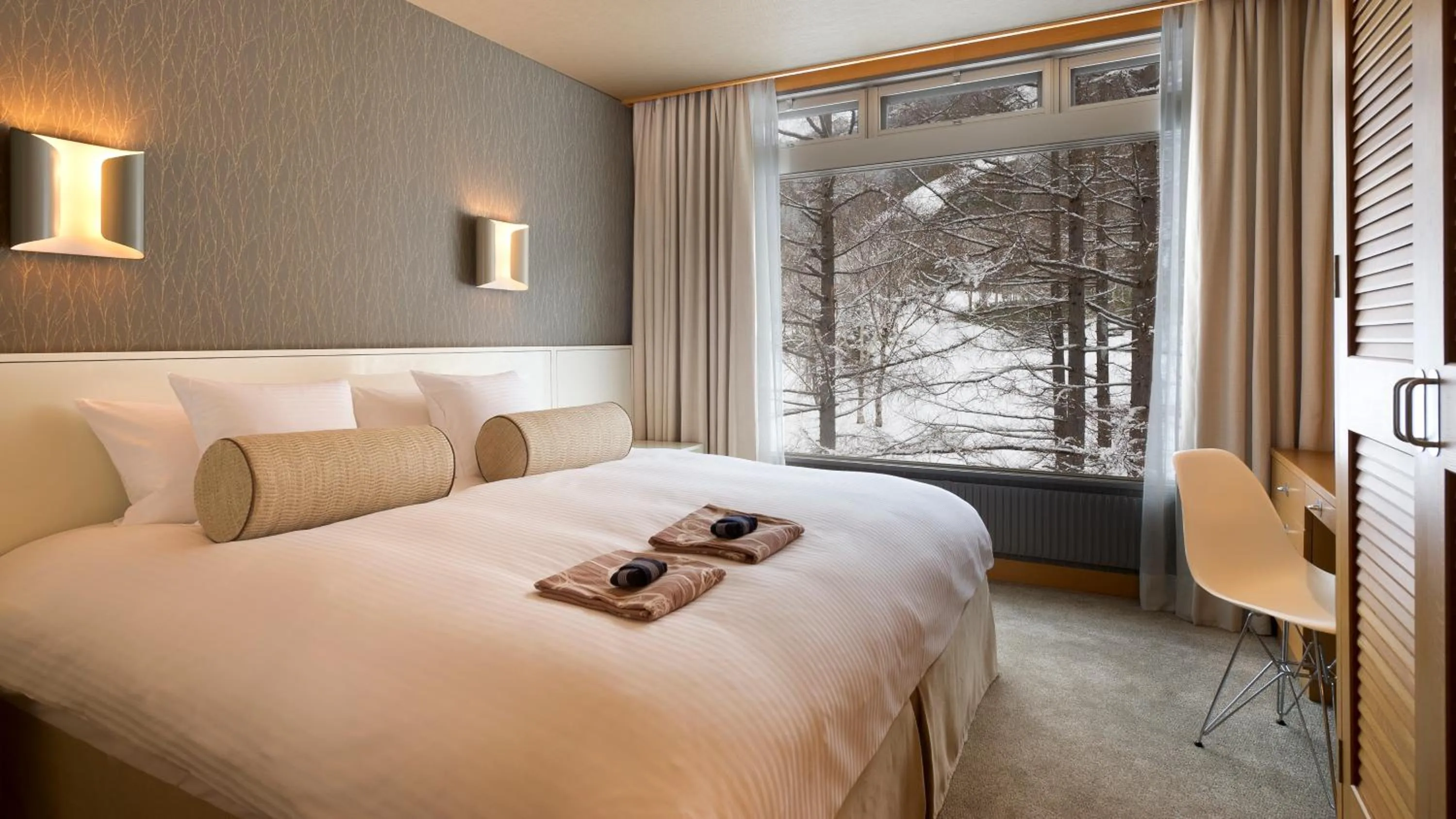 Bed in The Green Leaf Niseko Village, Tapestry Collection by Hilton