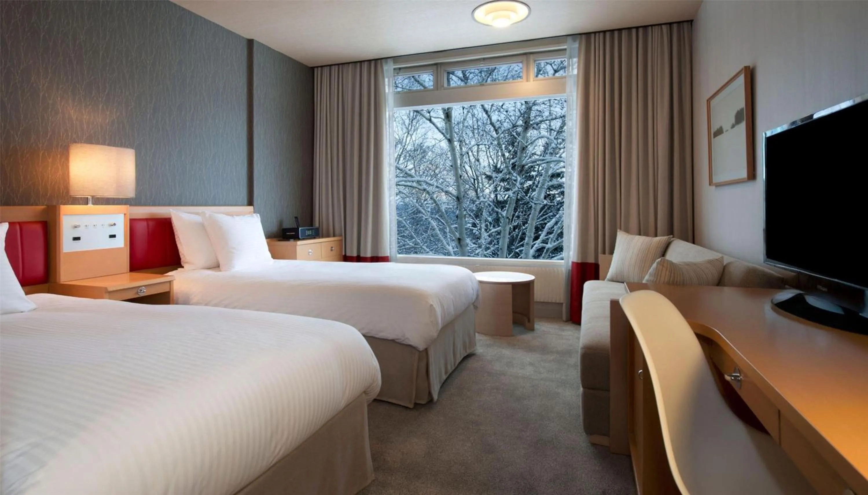 Bed in The Green Leaf Niseko Village, Tapestry Collection by Hilton