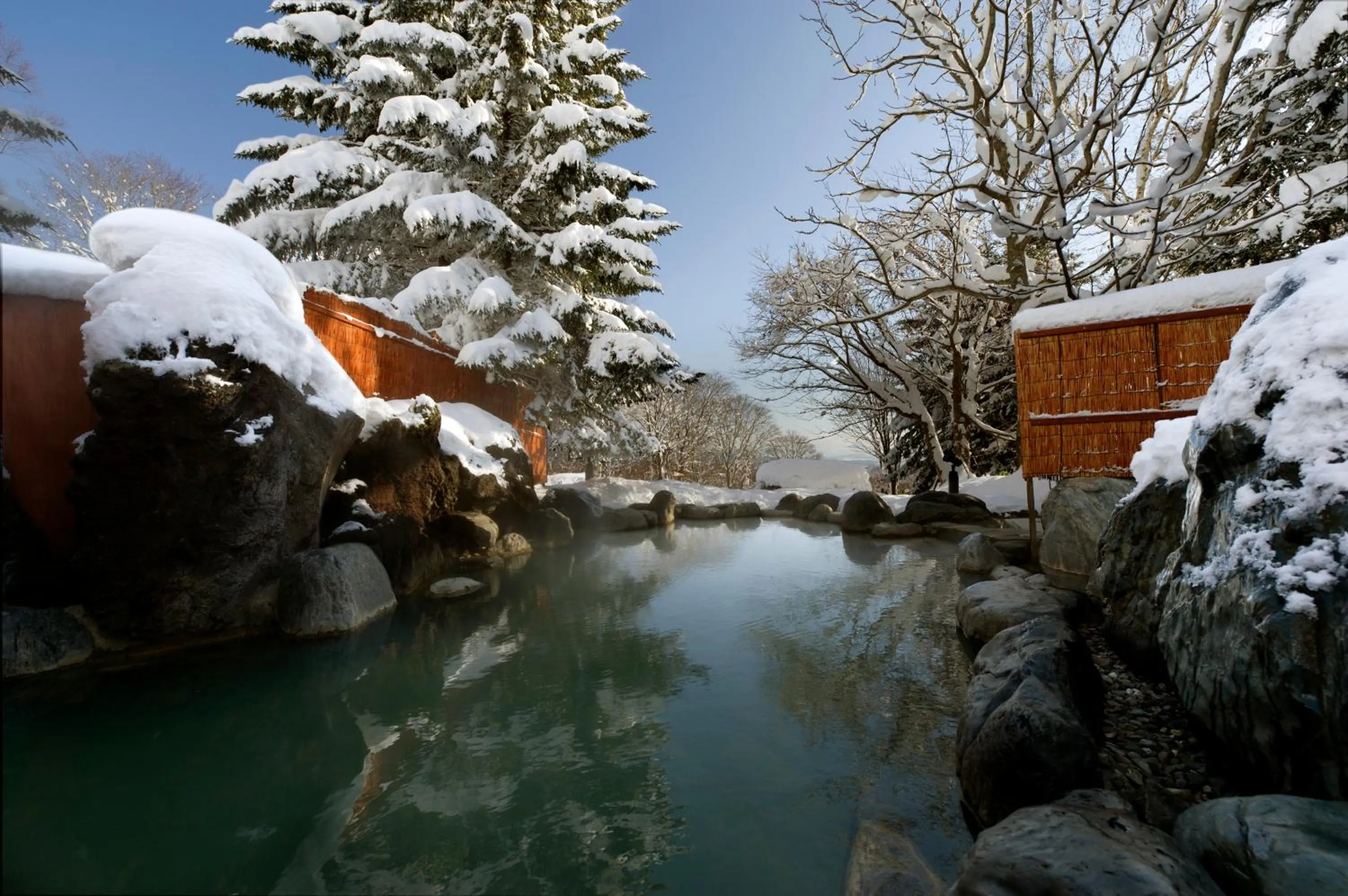 Hot Spring Bath in The Green Leaf Niseko Village, Tapestry Collection by Hilton