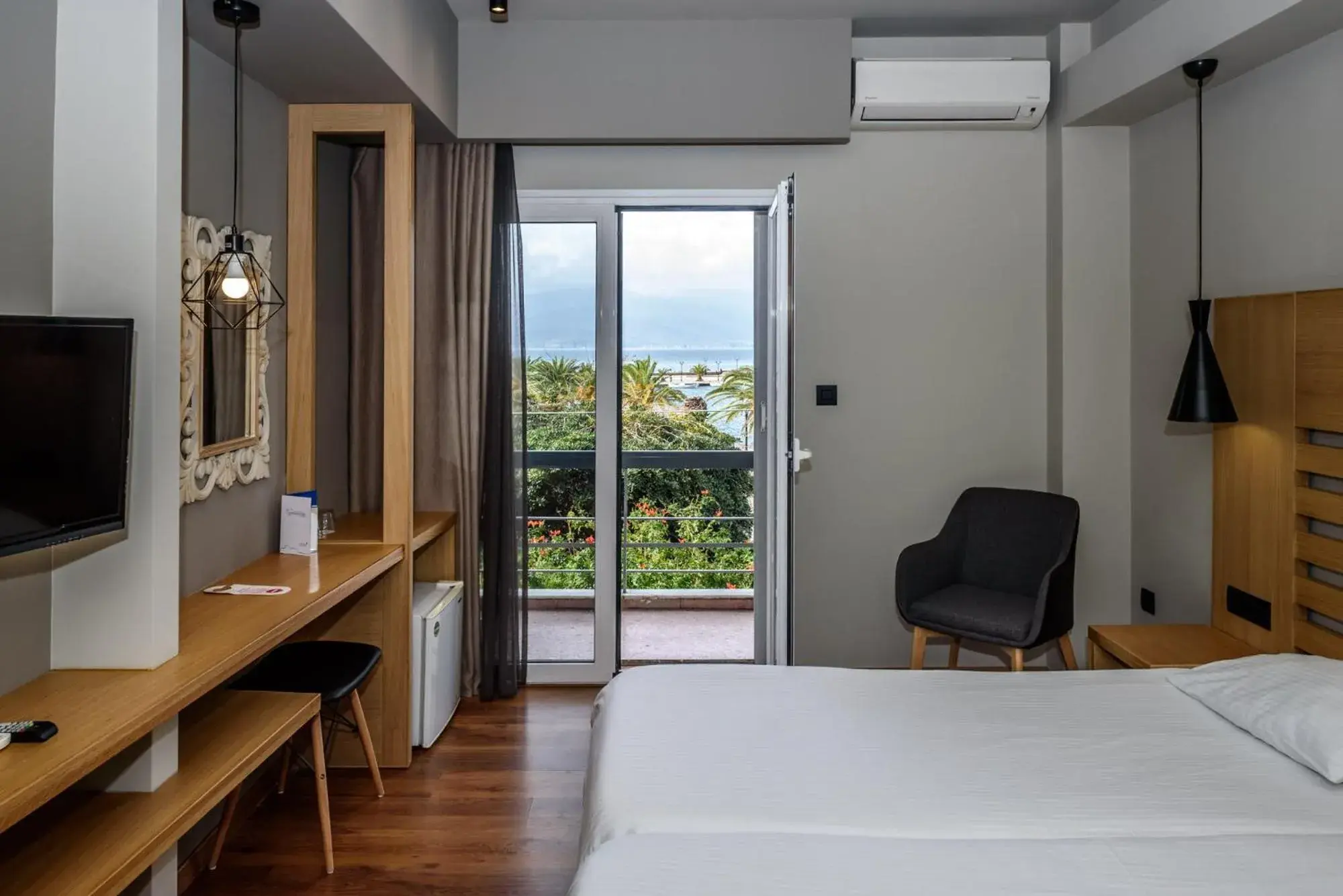 Standard Triple Room with Side Sea View in Agamemnon Hotel Standard Triple Room with Side Sea View in Agamemnon Hotel