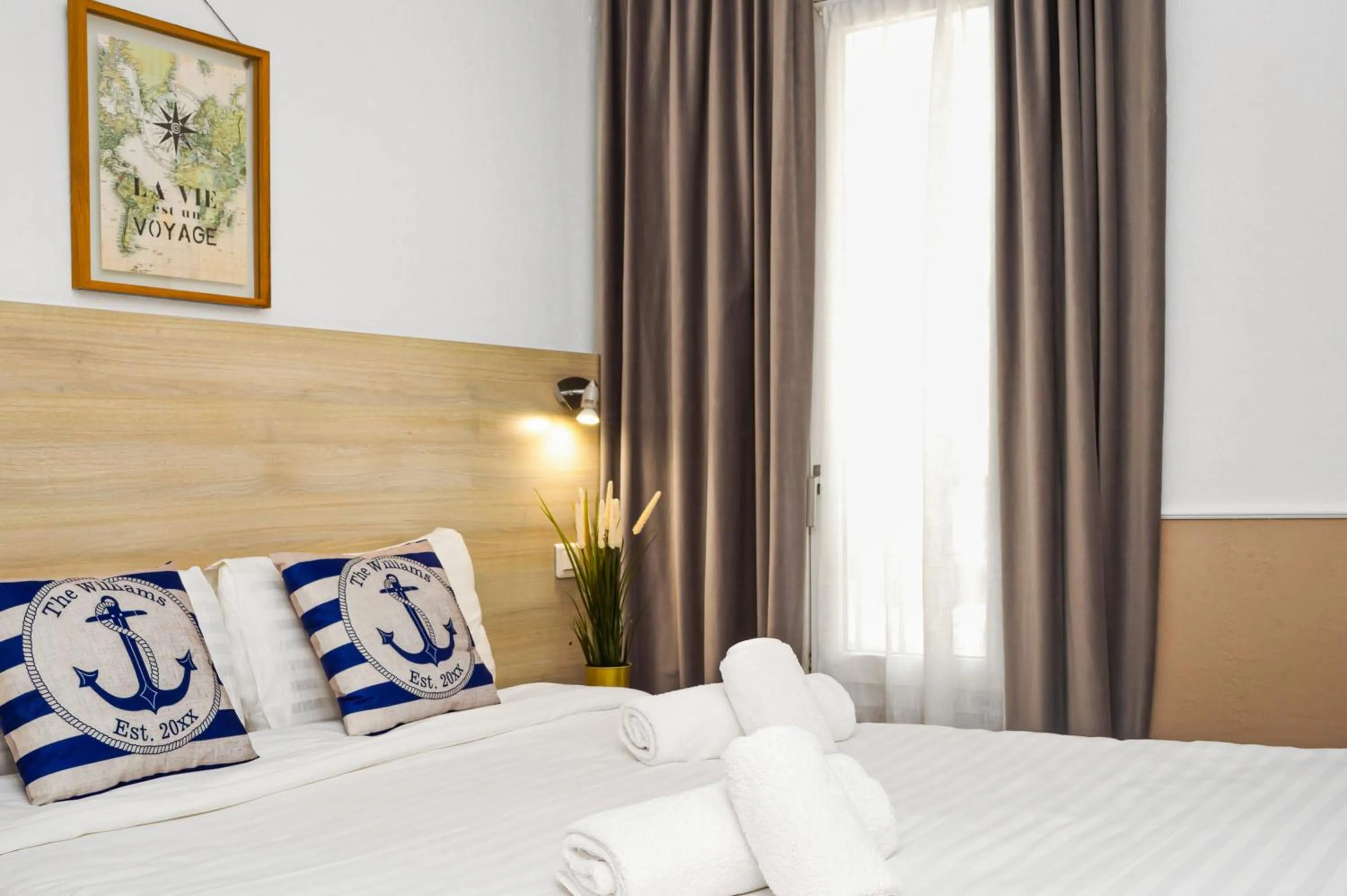 Bed in Hotel Parisien