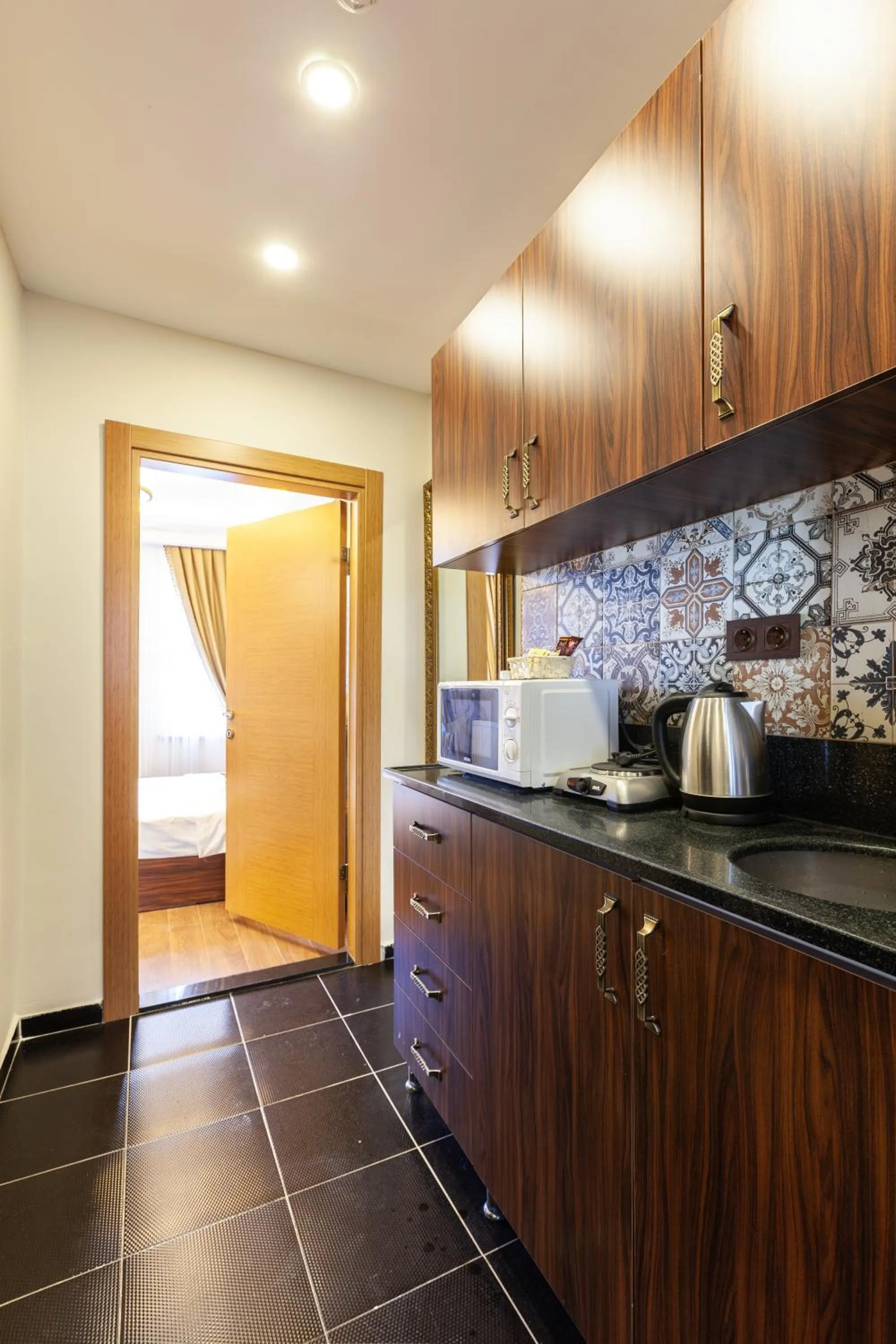 Kitchen or kitchenette in Rose Mansion by Otantik Suites