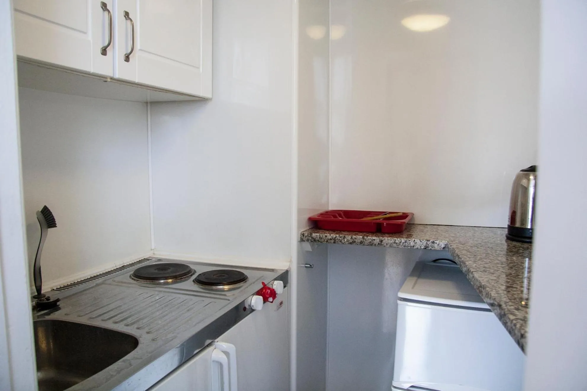 Kitchen or kitchenette in Caledonian Studio Flats