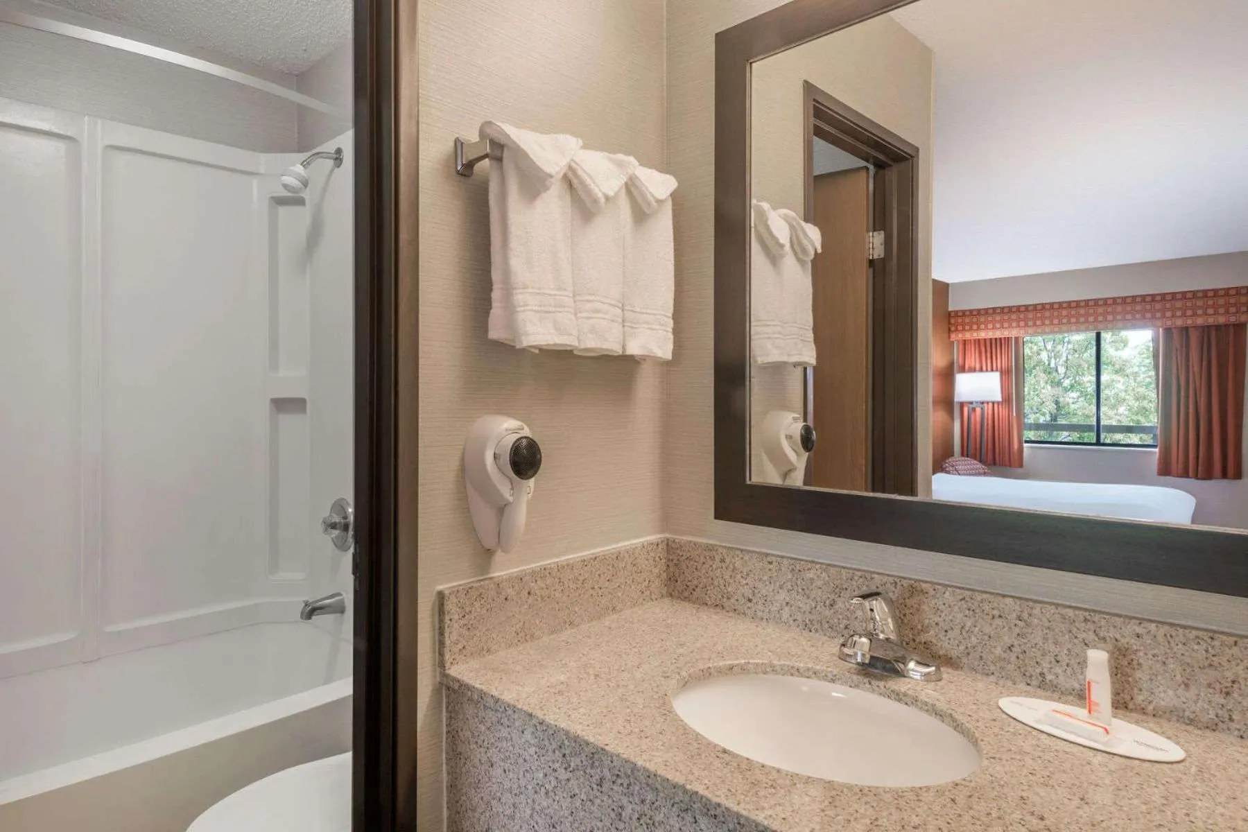 Bathroom in Days Inn by Wyndham Columbus Fairgrounds