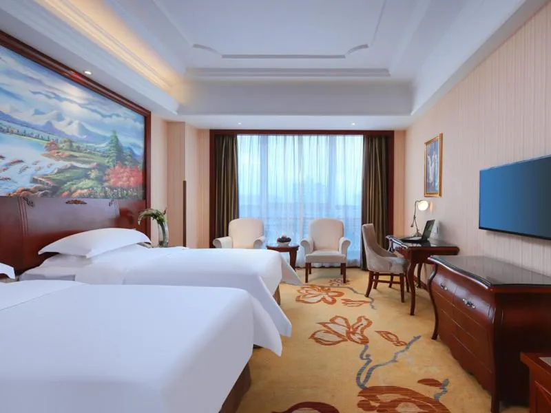 Bed in Vienna International Hotel Nanchang Xinjian Center