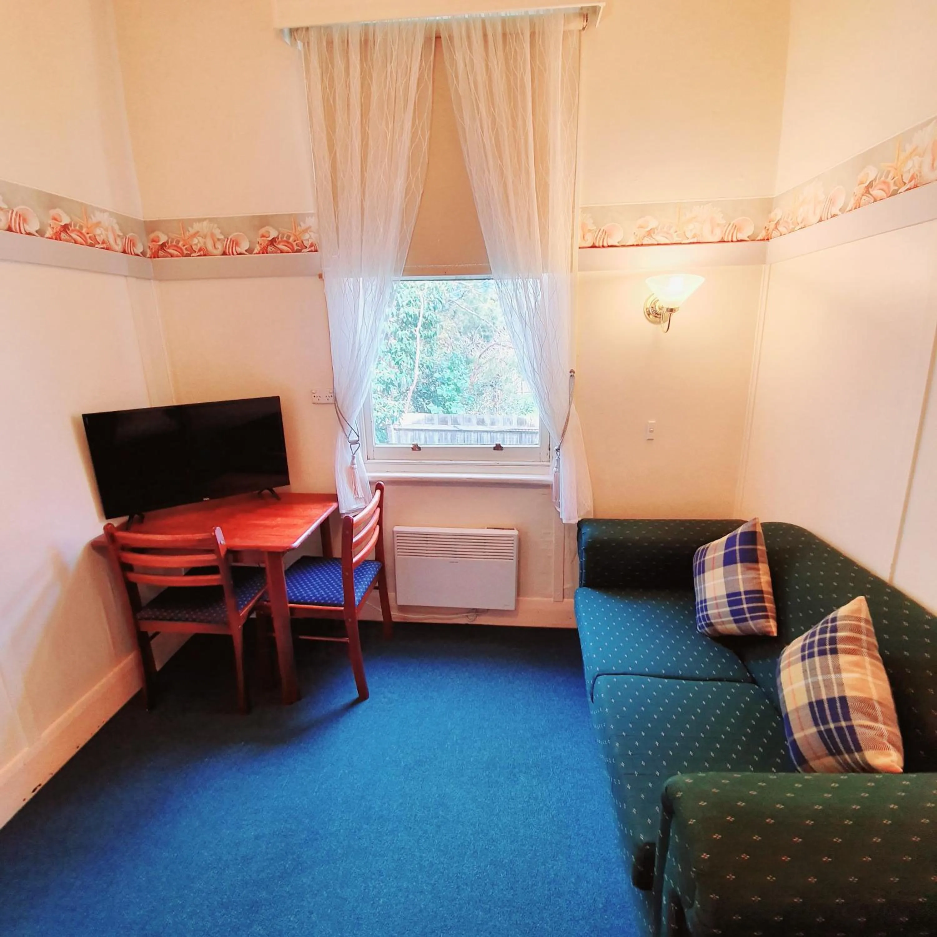 Seating area, Bed in Point Lonsdale Guest House