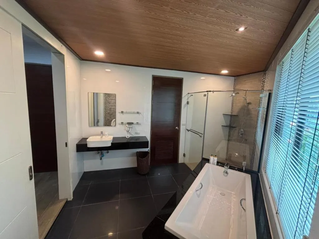 Bathroom, Bed in Phranang Place- SHA Extra