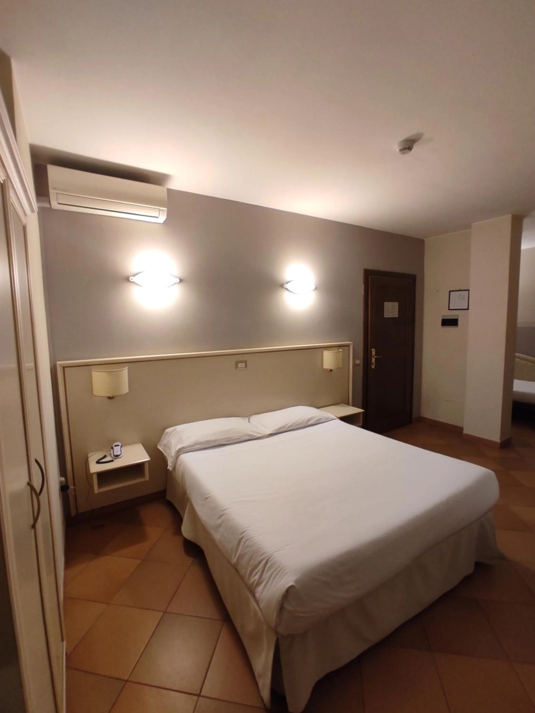 Bed in Hotel Le Mura