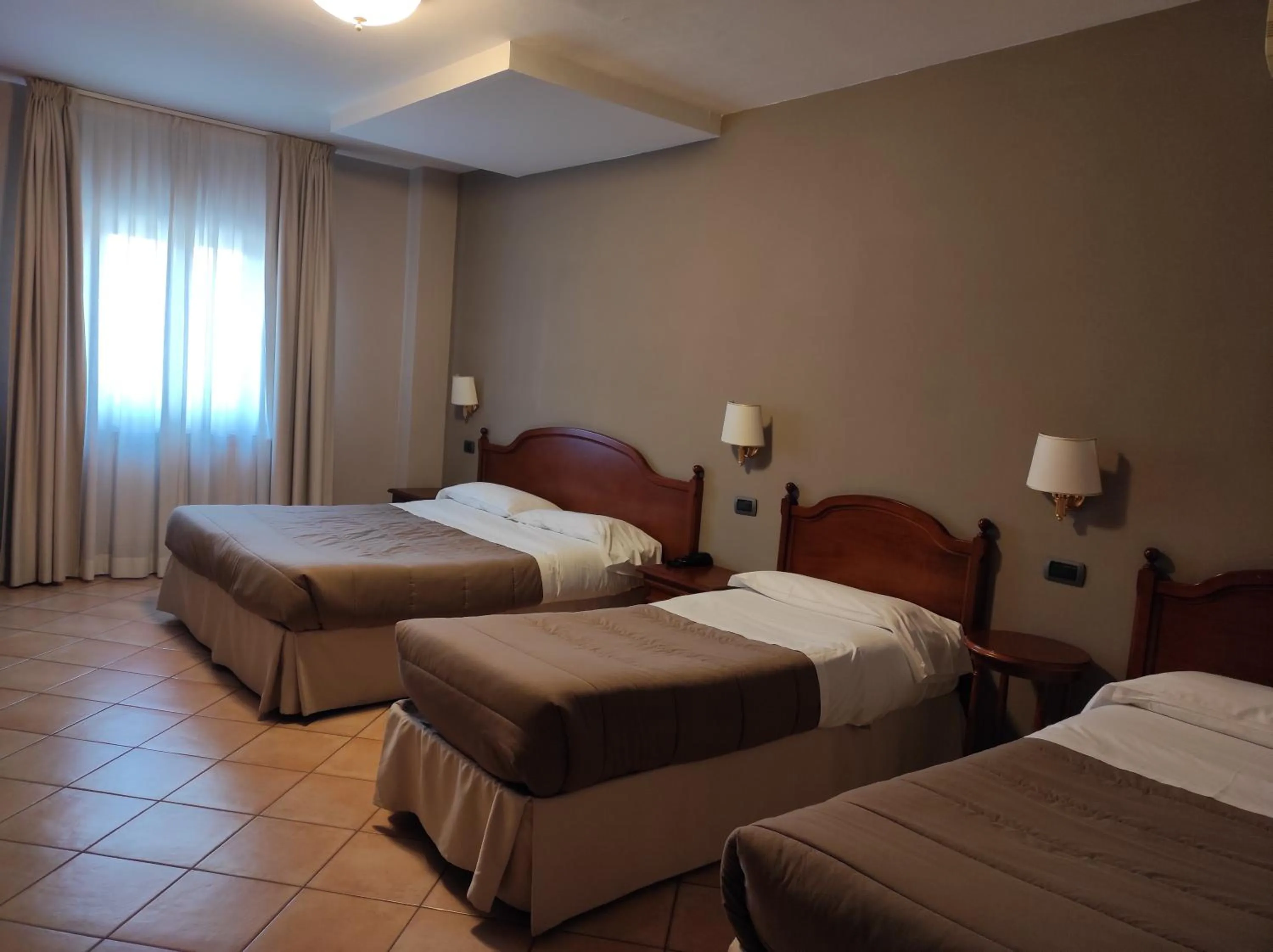 Bed in Hotel Le Mura