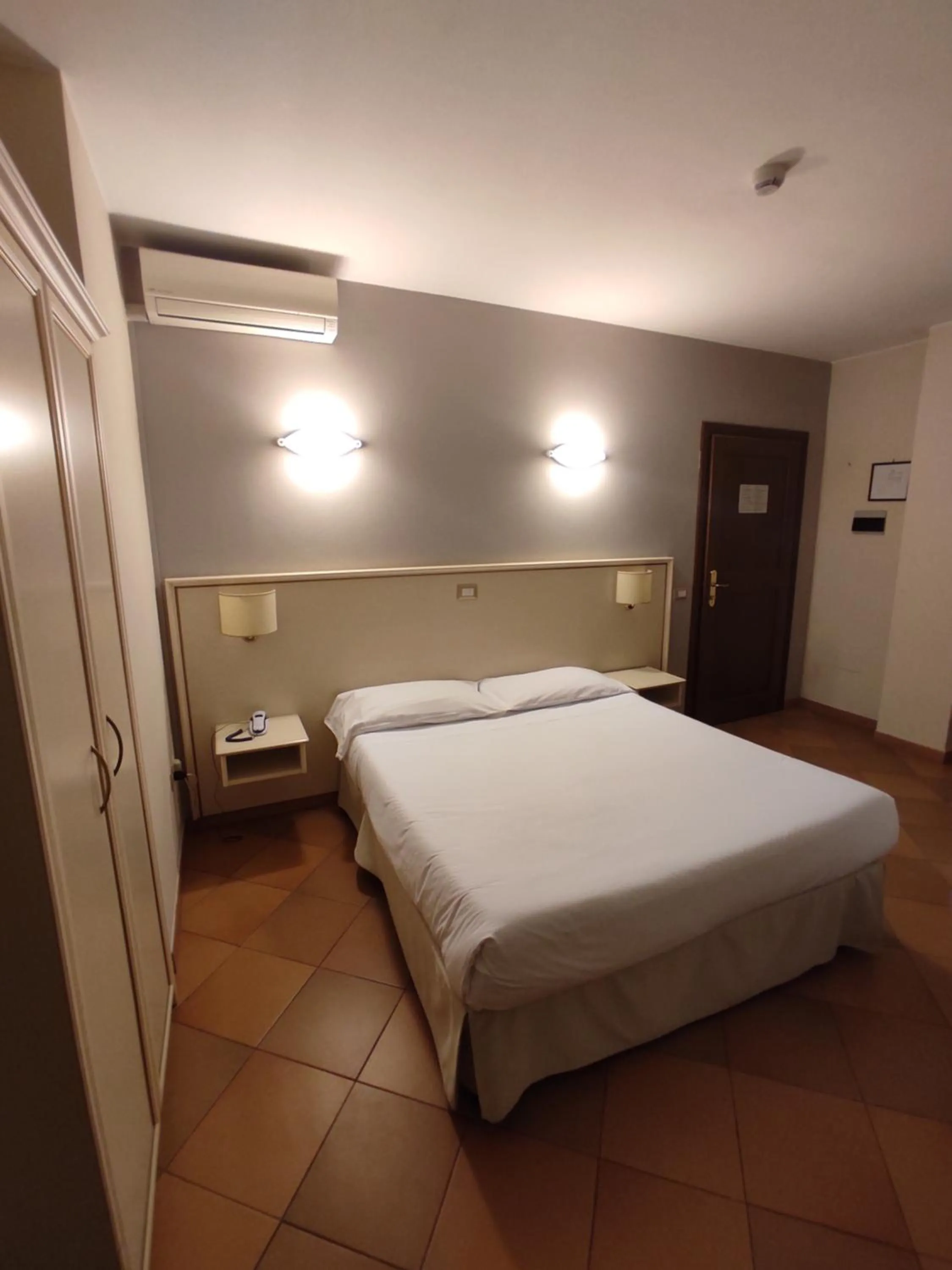 Bed in Hotel Le Mura