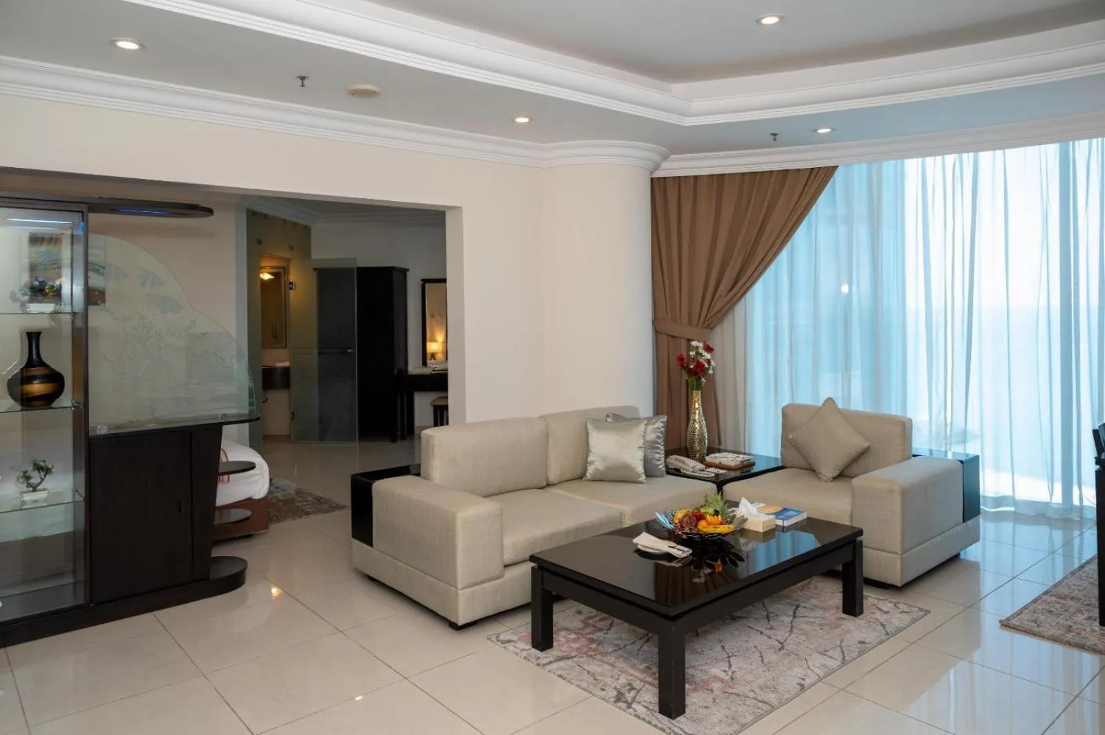 Living room in Costa Del Sol Hotel by Arabian Link