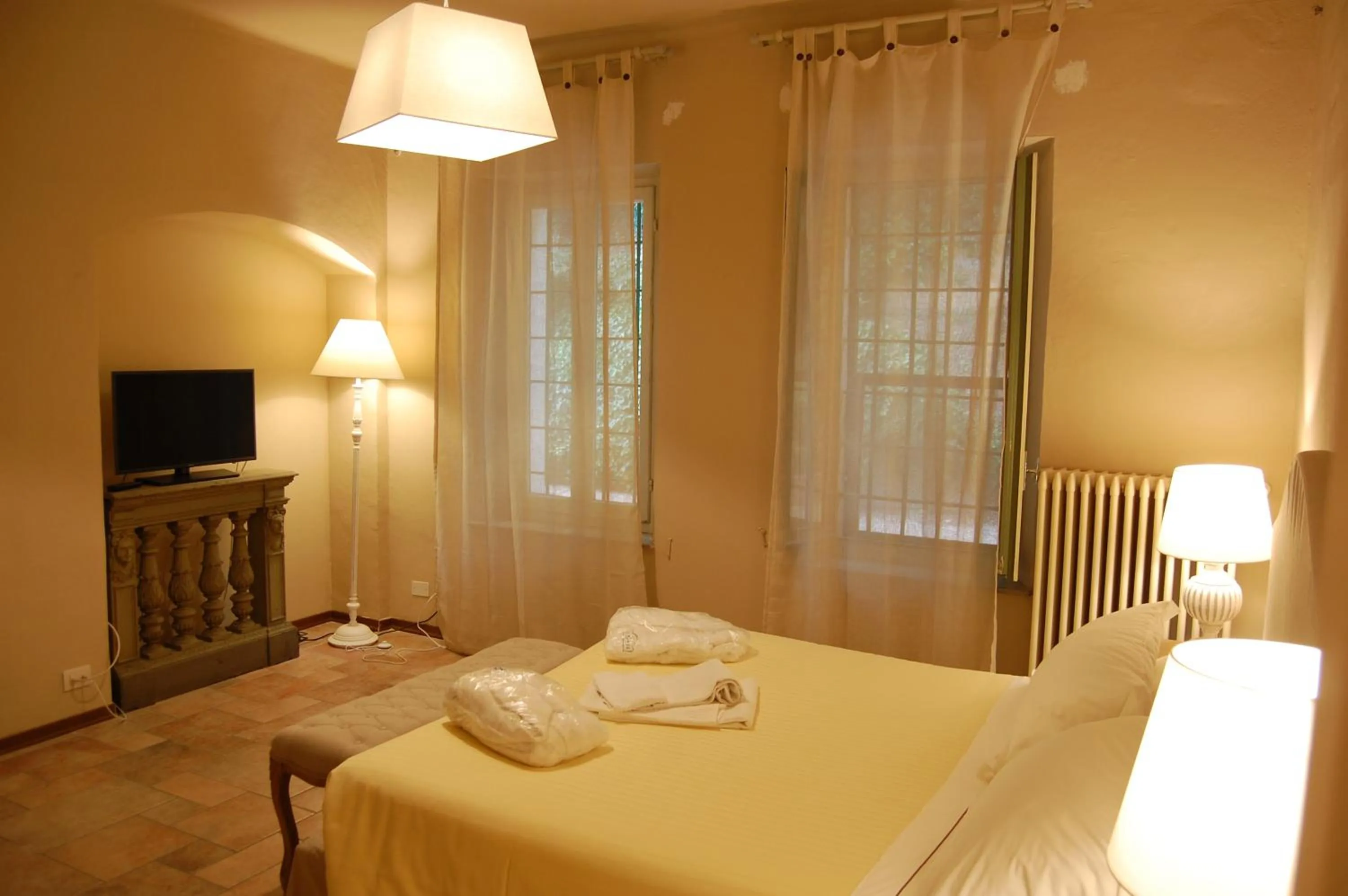 Bed in Le Serre Suites & Apartments