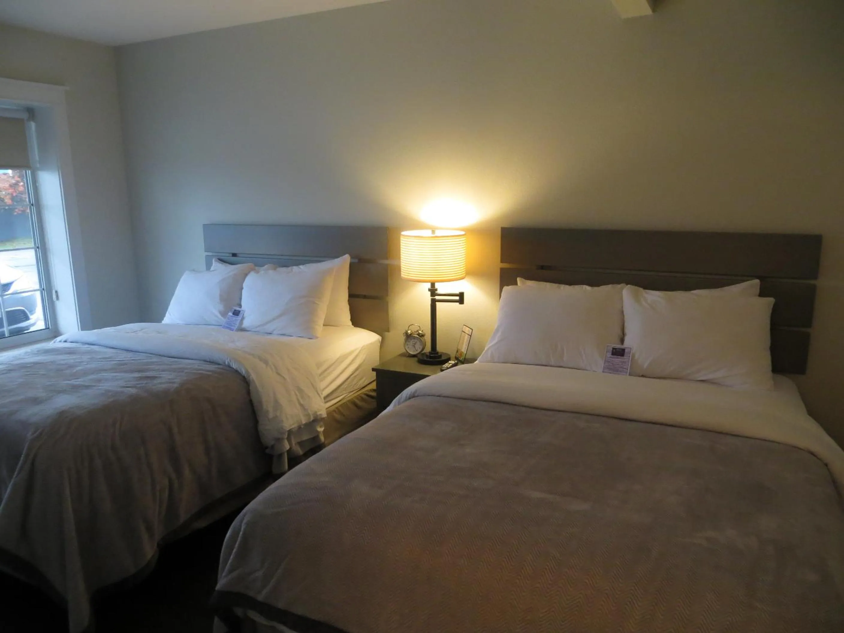 Bed in Brio Beach Inn