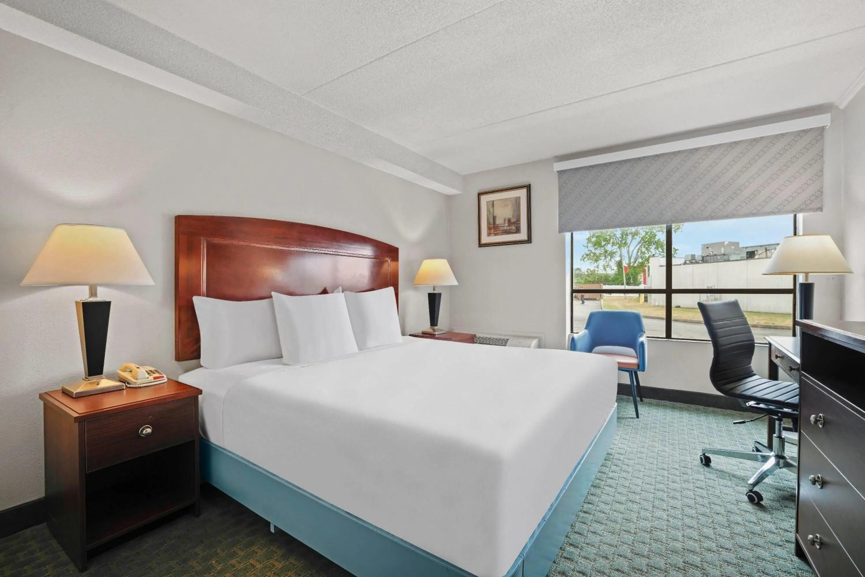 Bed in Days Inn by Wyndham Utica