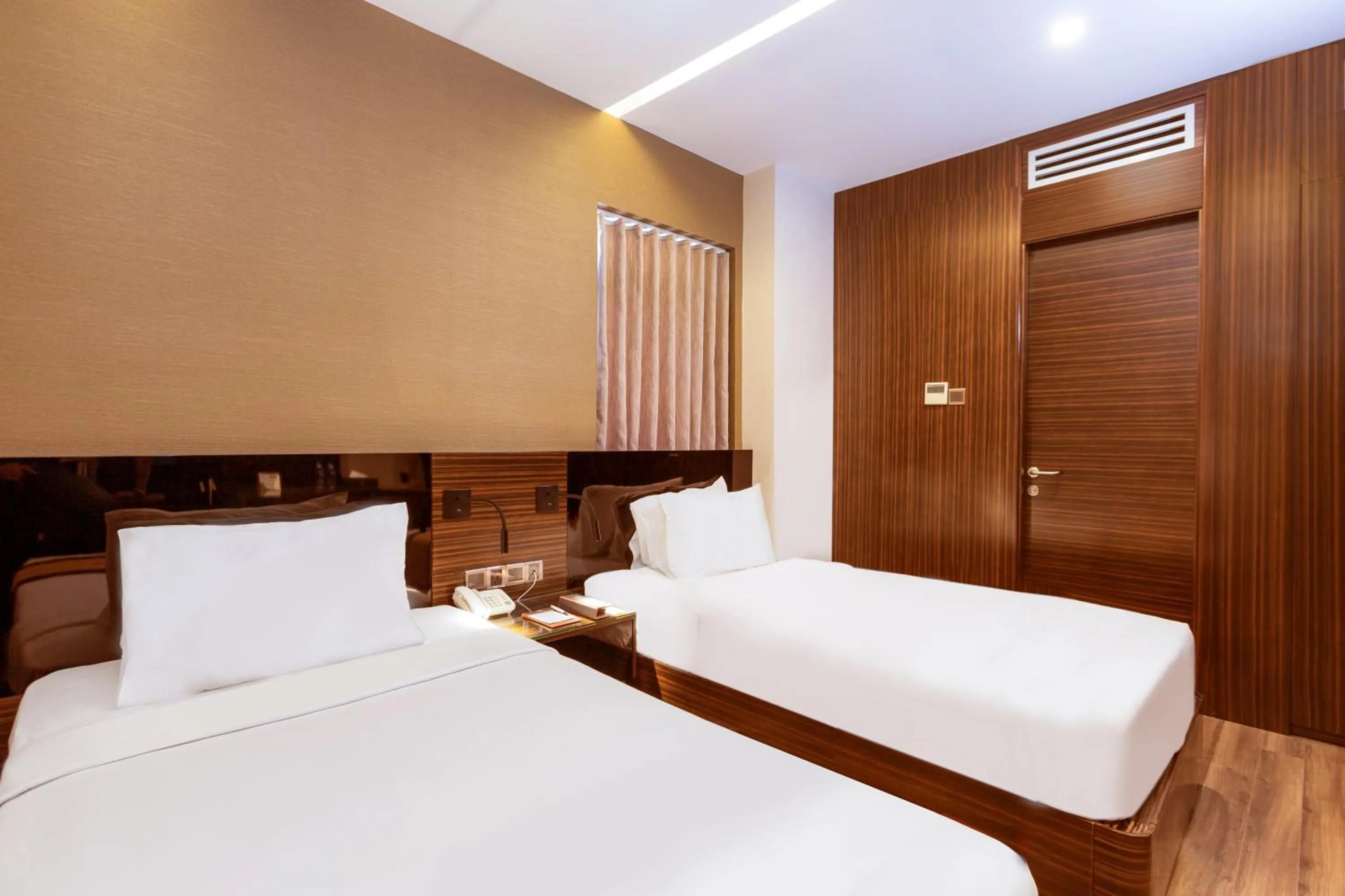 Bed in Queen Ann Hotel