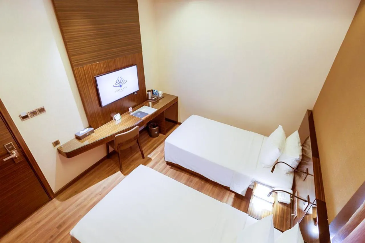 Bed in Queen Ann Hotel