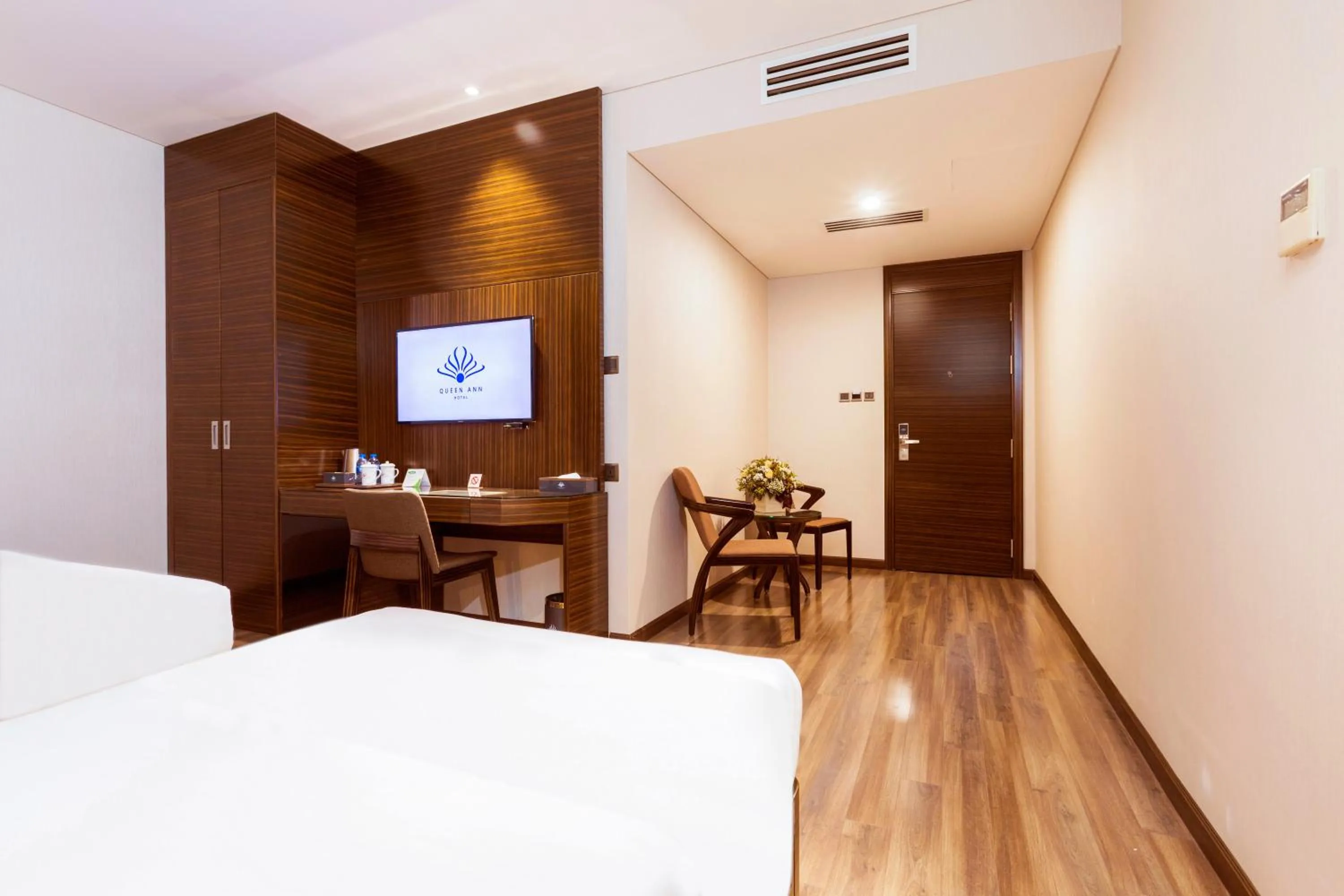 Bed in Queen Ann Hotel