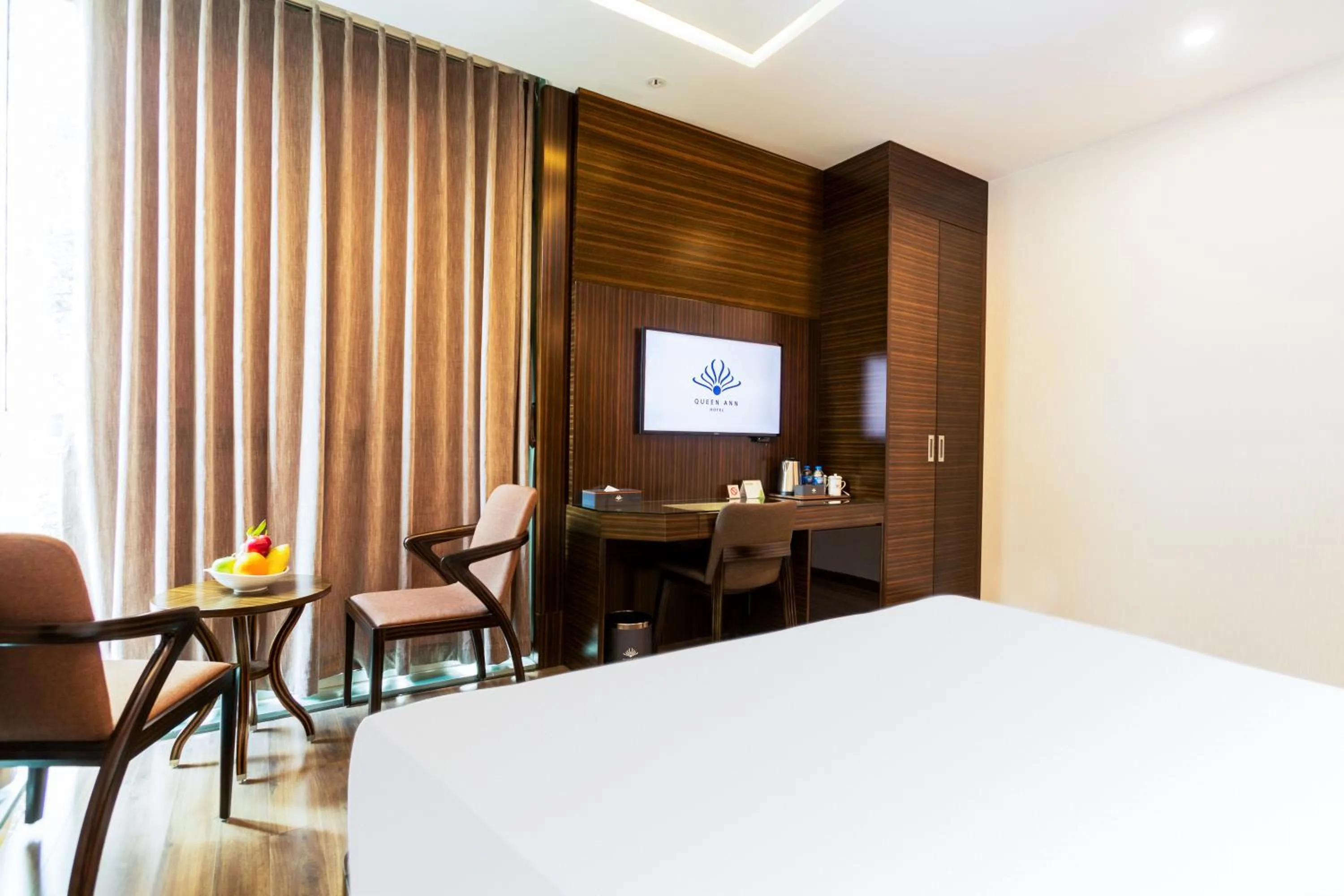 Bed in Queen Ann Hotel