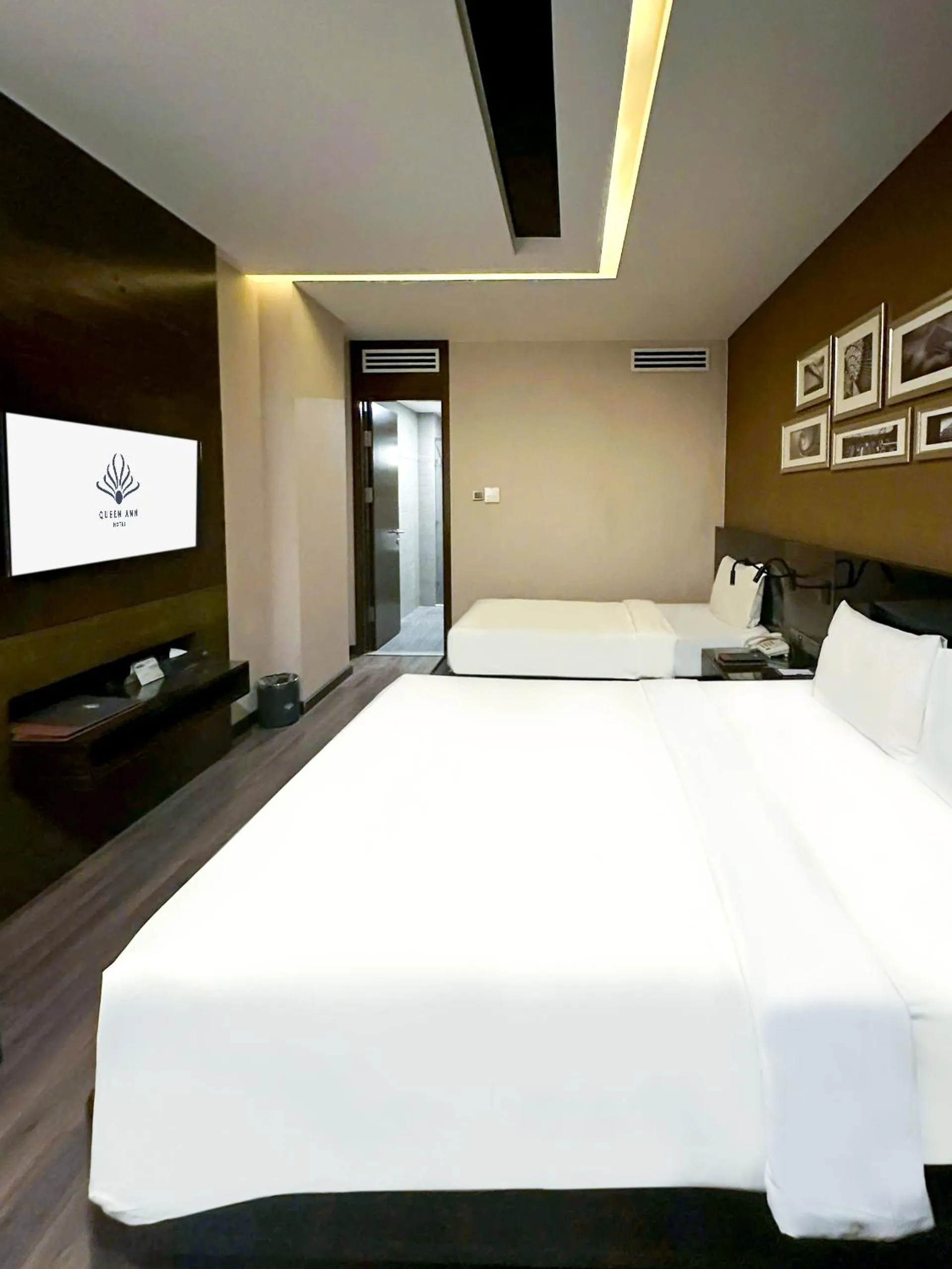 Bed in Queen Ann Hotel