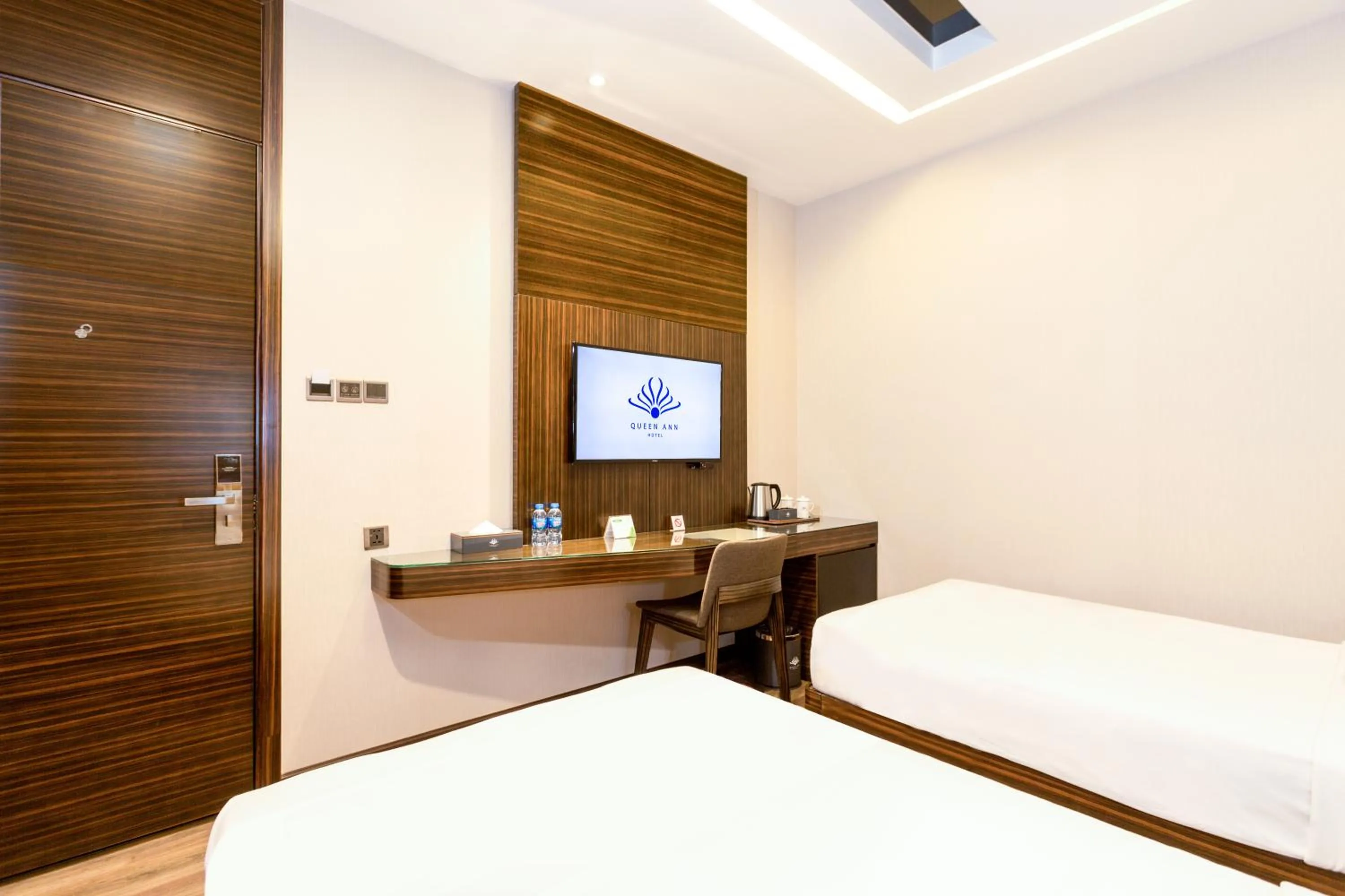 Bed in Queen Ann Hotel