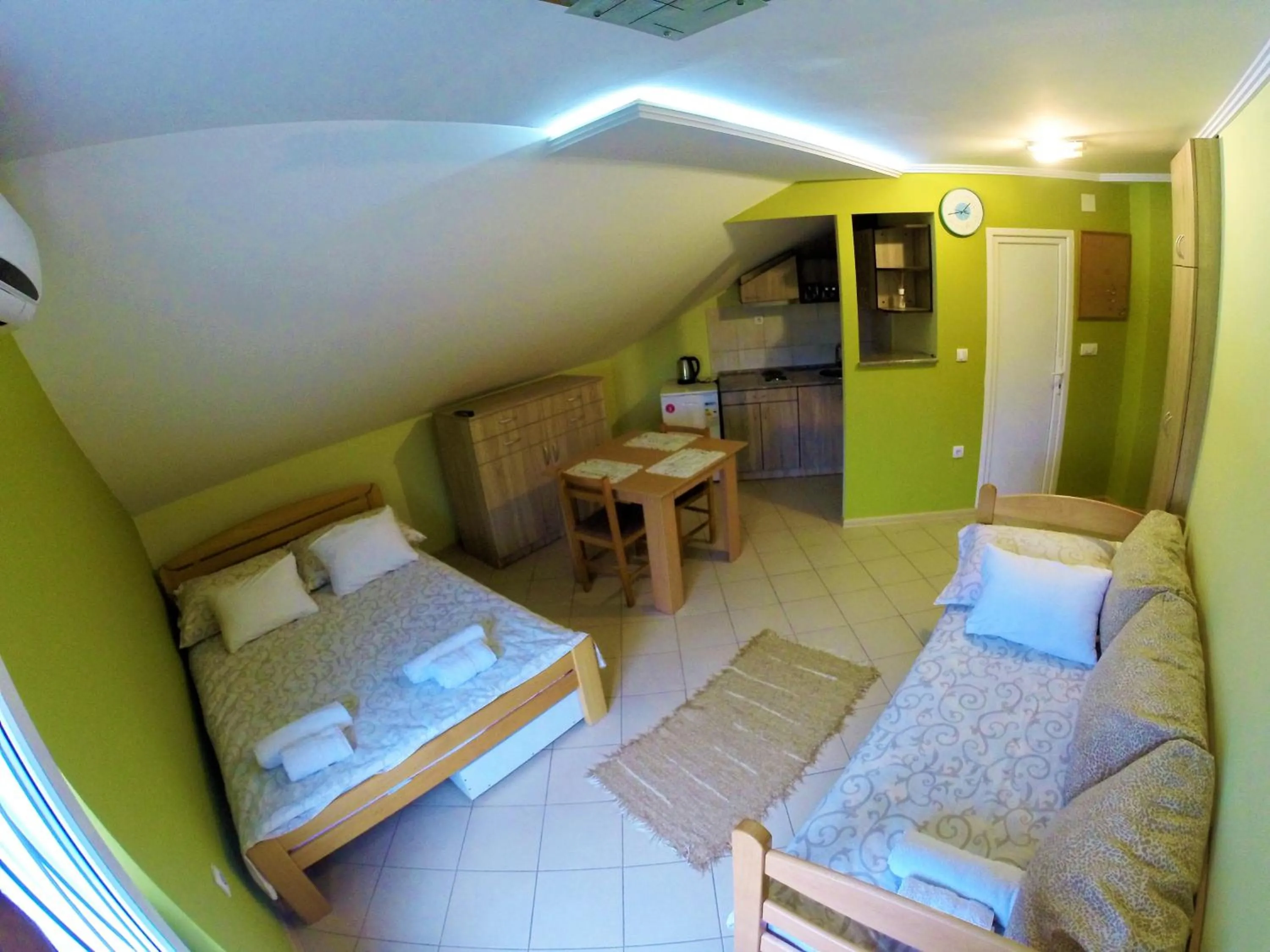 Kitchen or kitchenette, Bed in Apartments Popovic