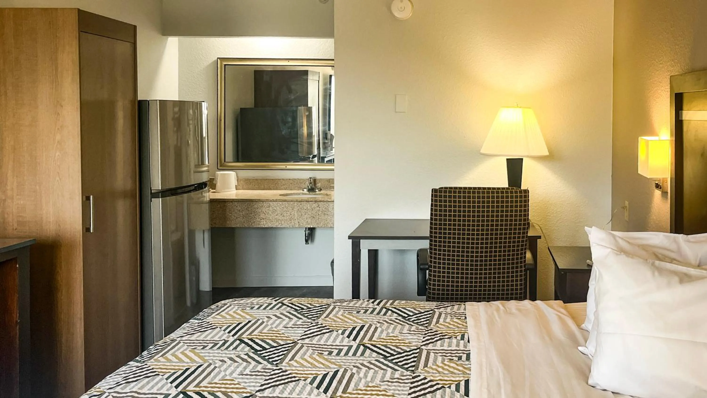 Bed in Studio 6 Suites Dallas TX - Loop 12 West