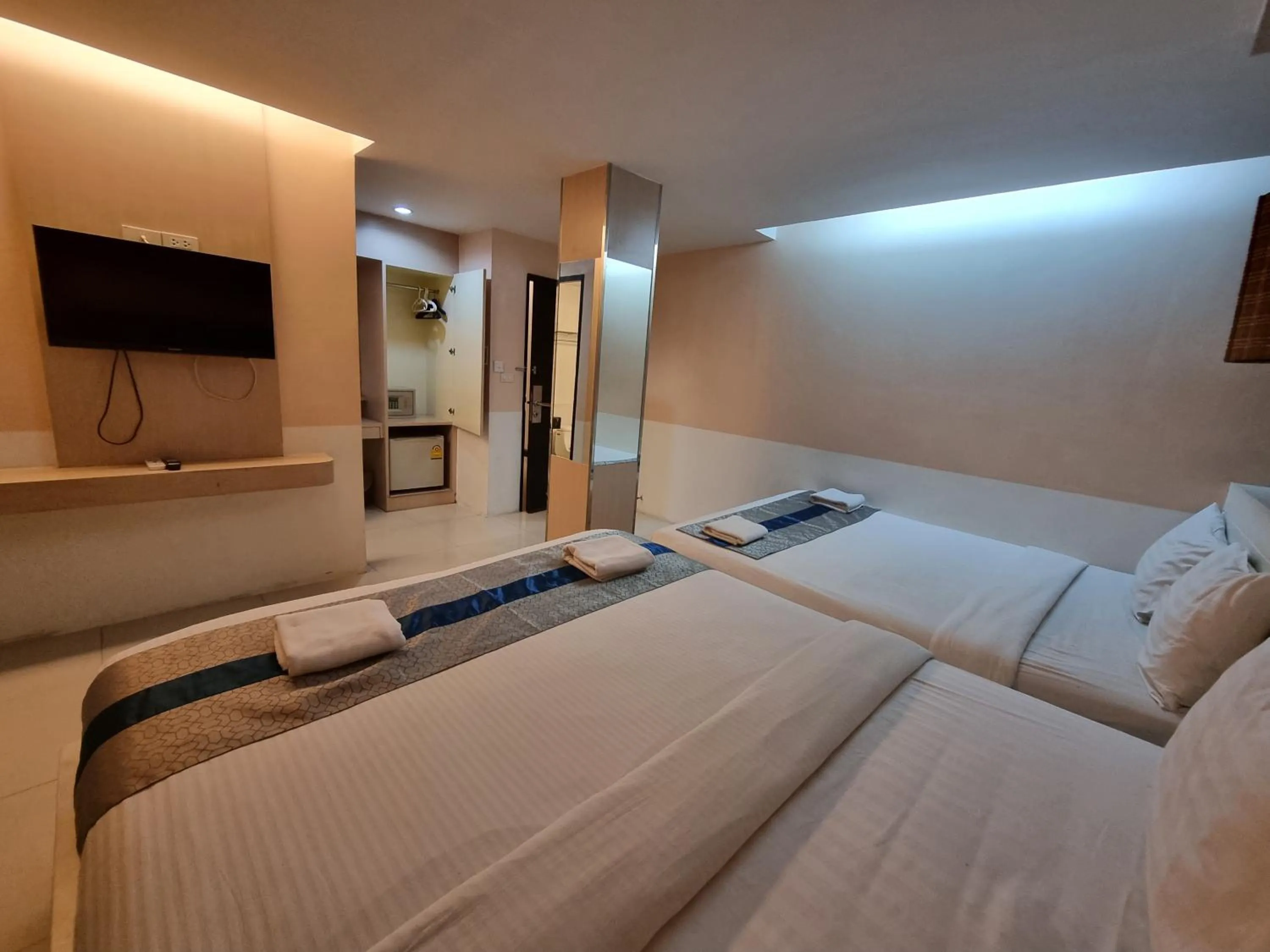 Bed in Cozi Inn Hotel, Bangkok