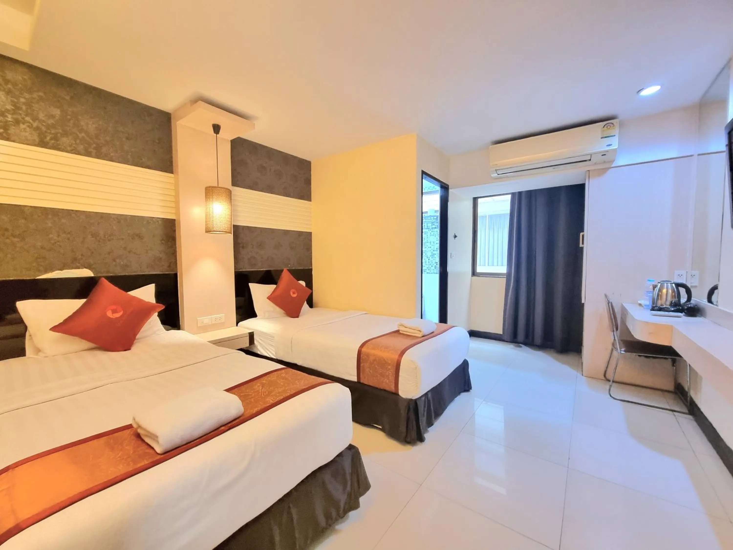 Bed in Cozi Inn Hotel, Bangkok