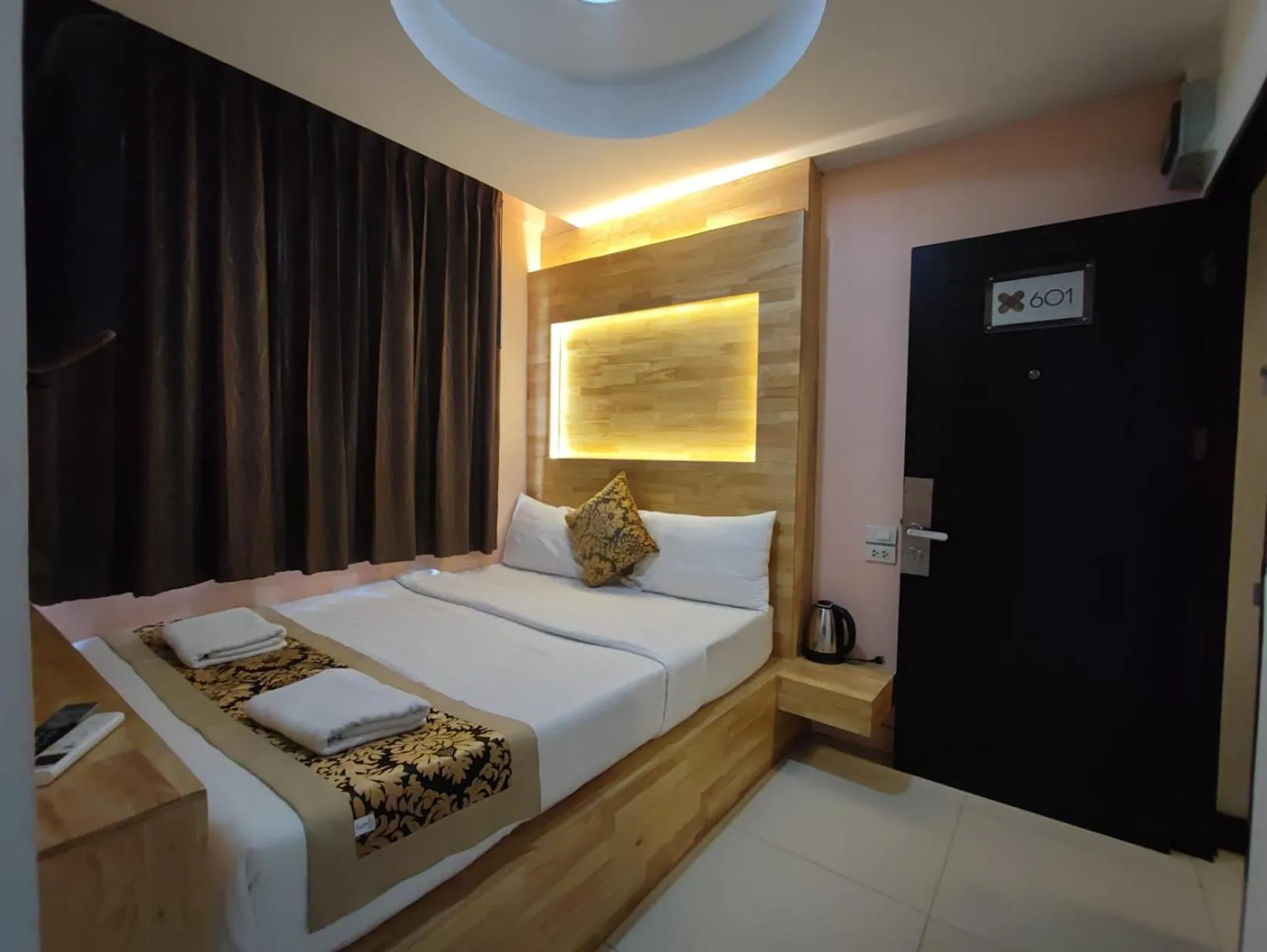 Bed in Cozi Inn Hotel, Bangkok