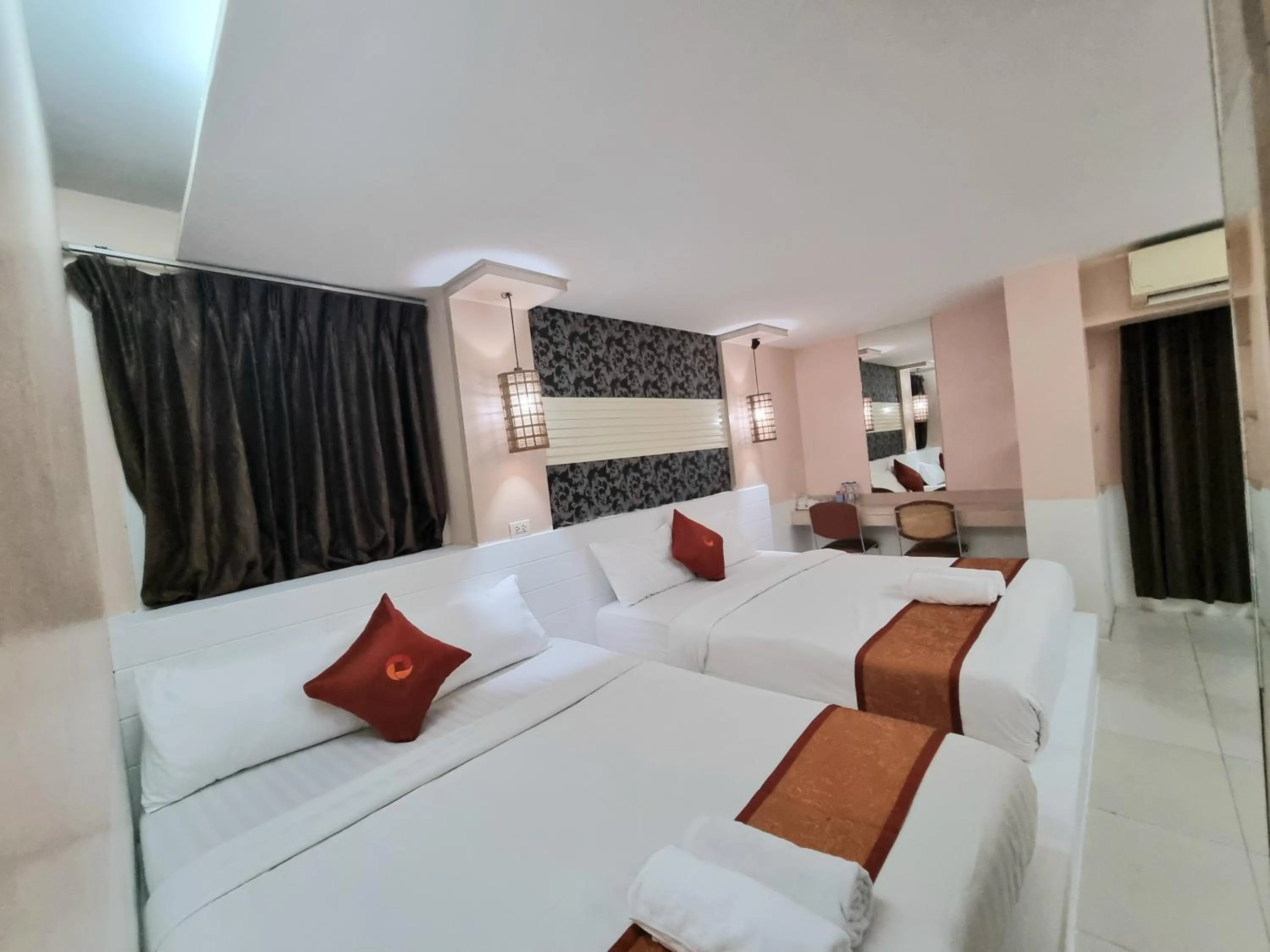 Bed in Cozi Inn Hotel, Bangkok