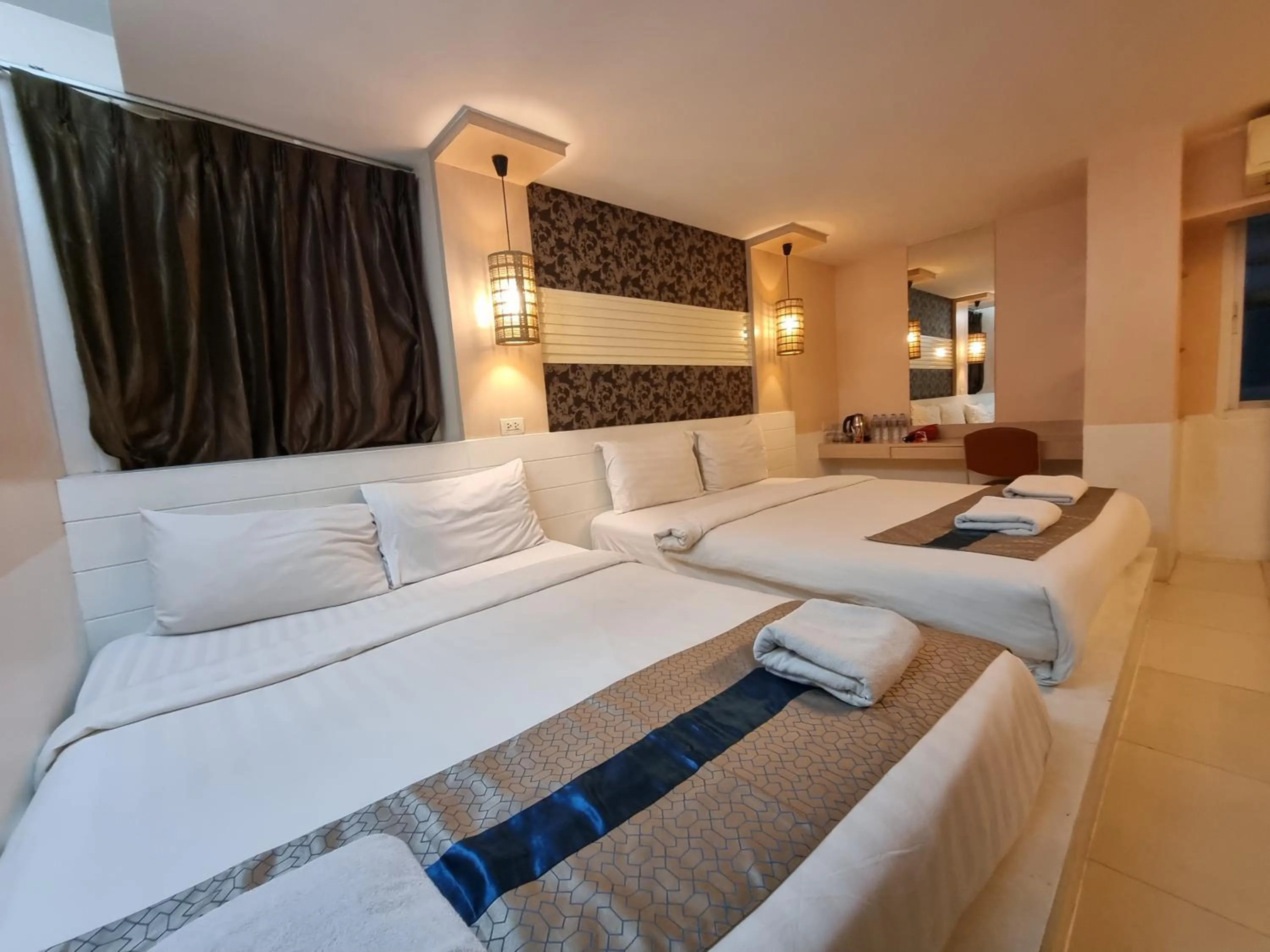 Bed in Cozi Inn Hotel, Bangkok