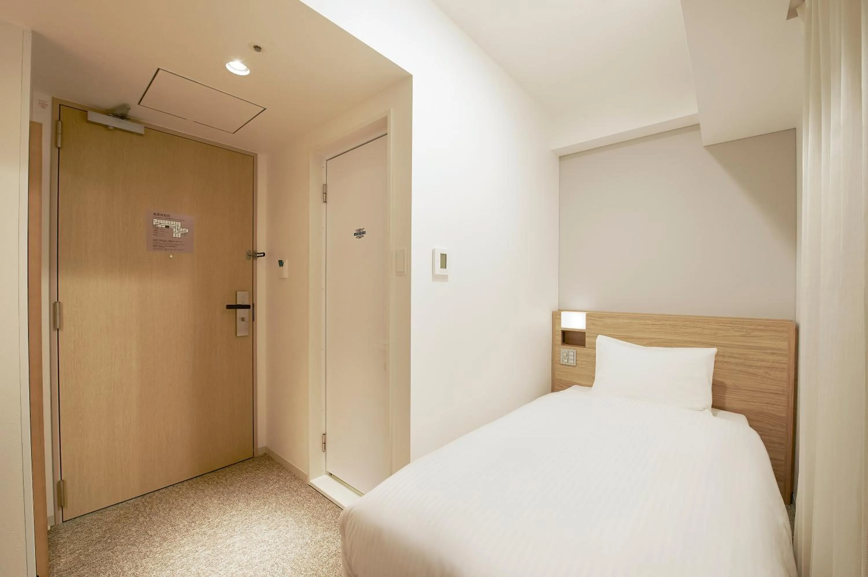 Bed in Sotetsu Fresa Inn Tokyo Kinshicho