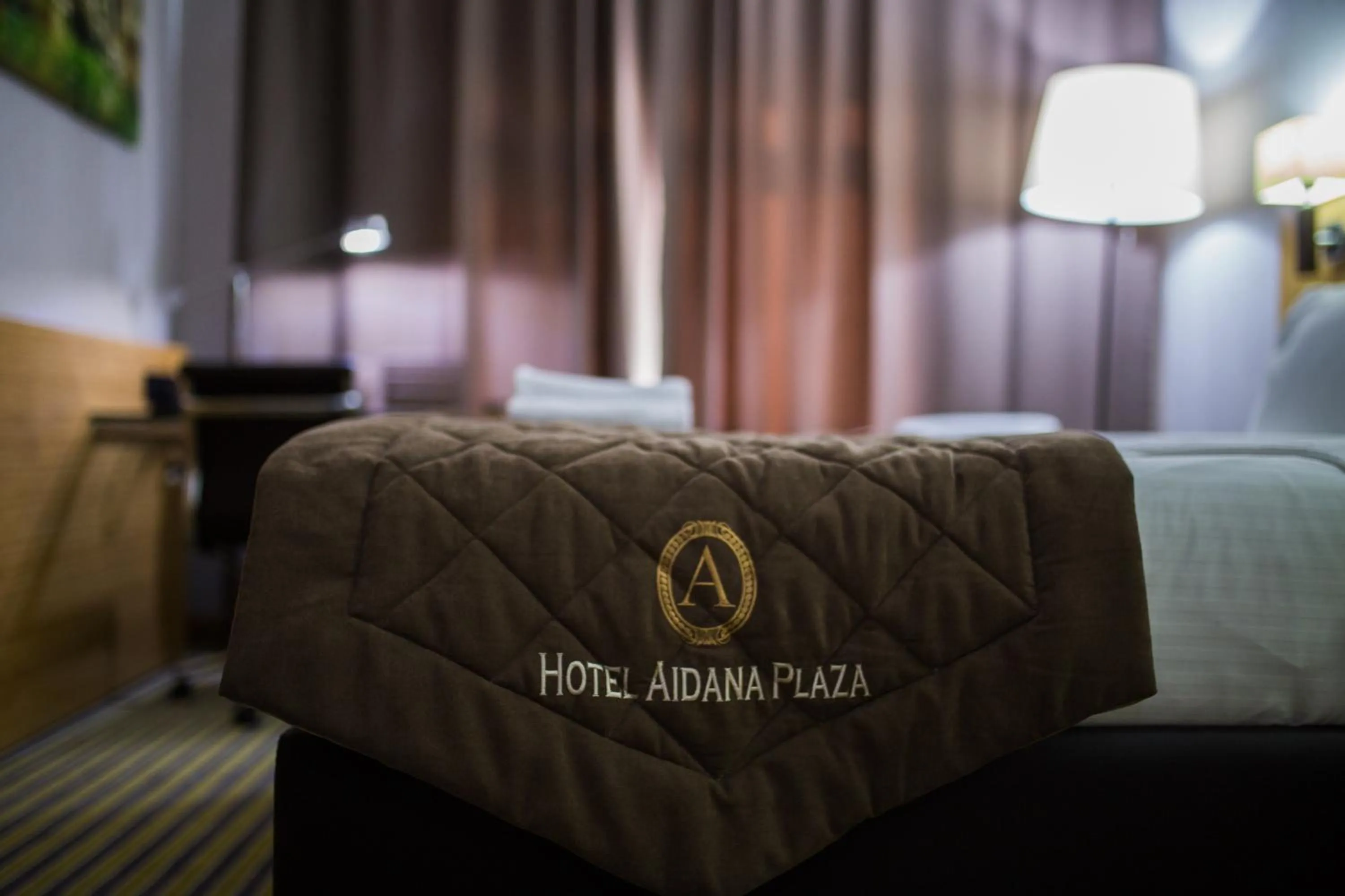 Bed in Aidana Plaza Hotel