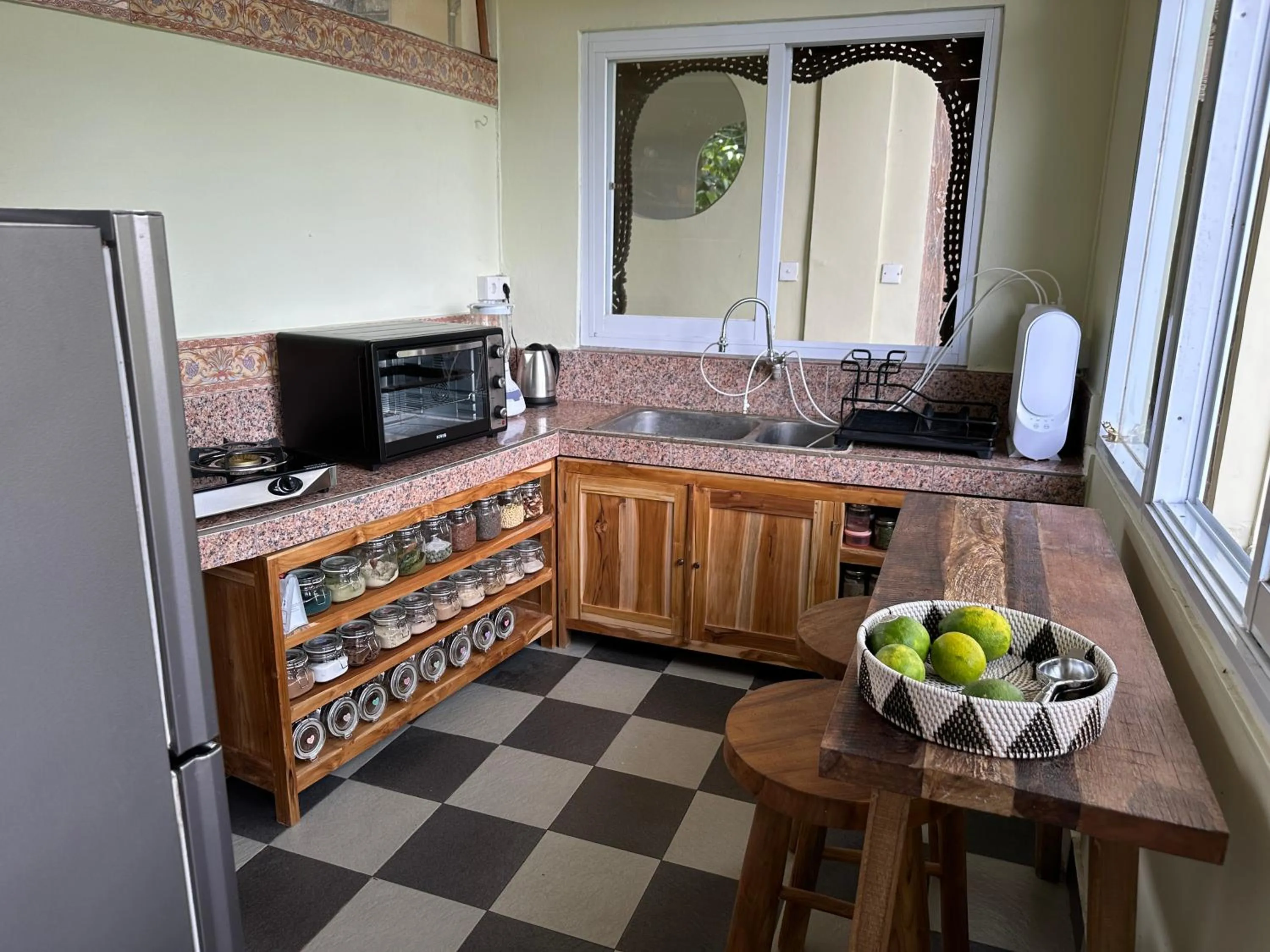 Kitchen or kitchenette in Tirta Asri Ubud Villa