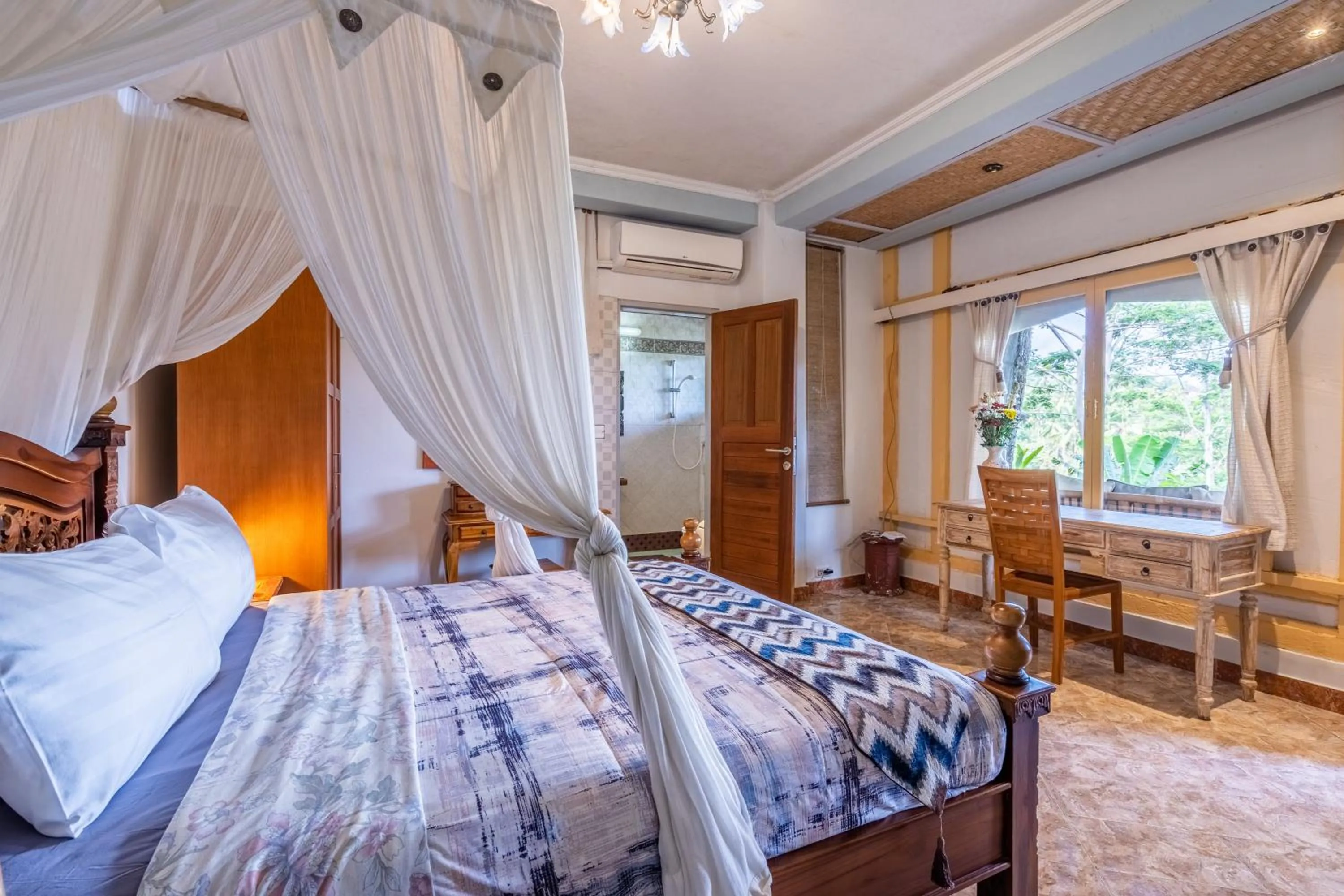 Bed in Tirta Asri Ubud Villa