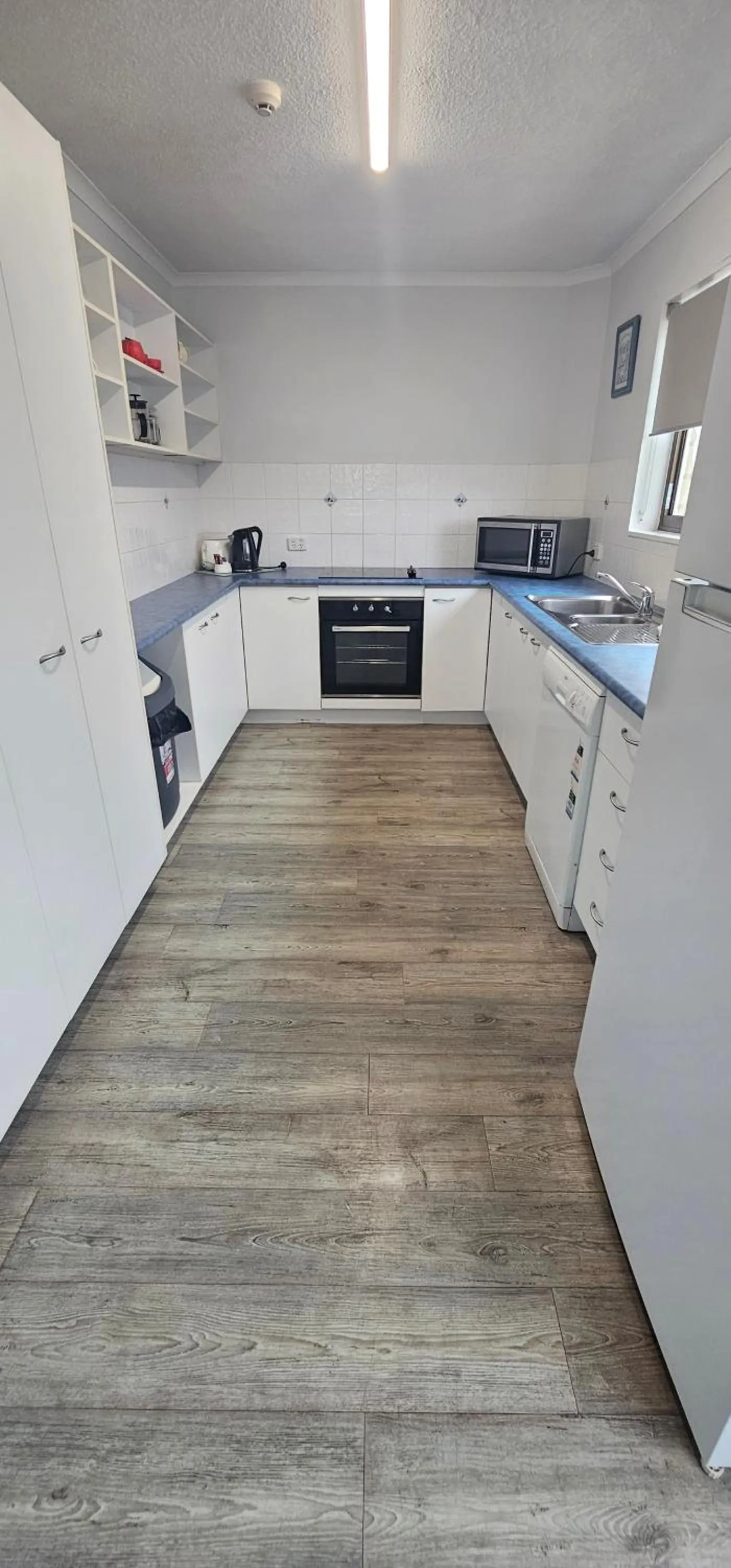 Kitchen or kitchenette in Kalua Holiday Apartments