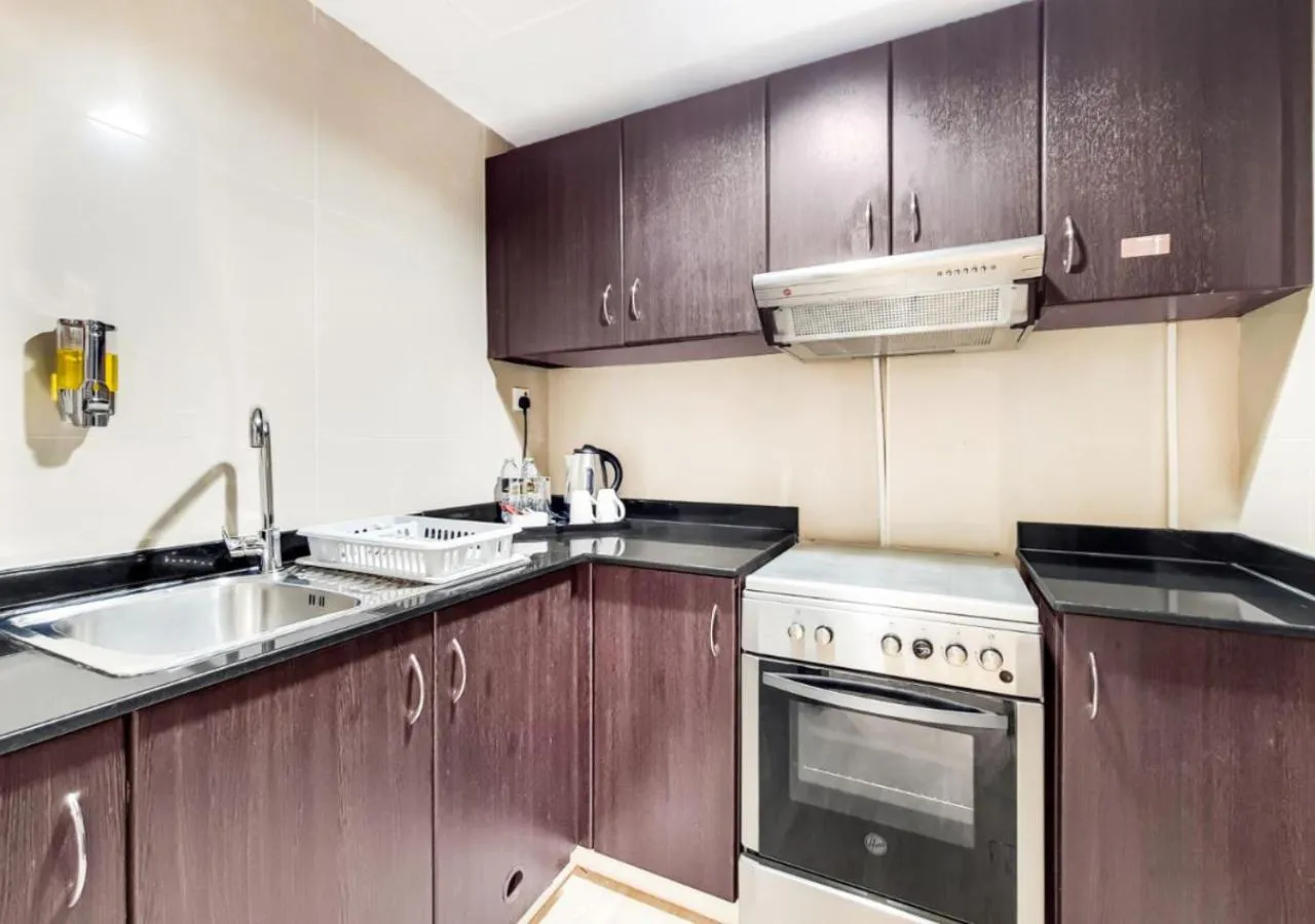 Kitchen or kitchenette in Two Seasons Hotel & Apartments