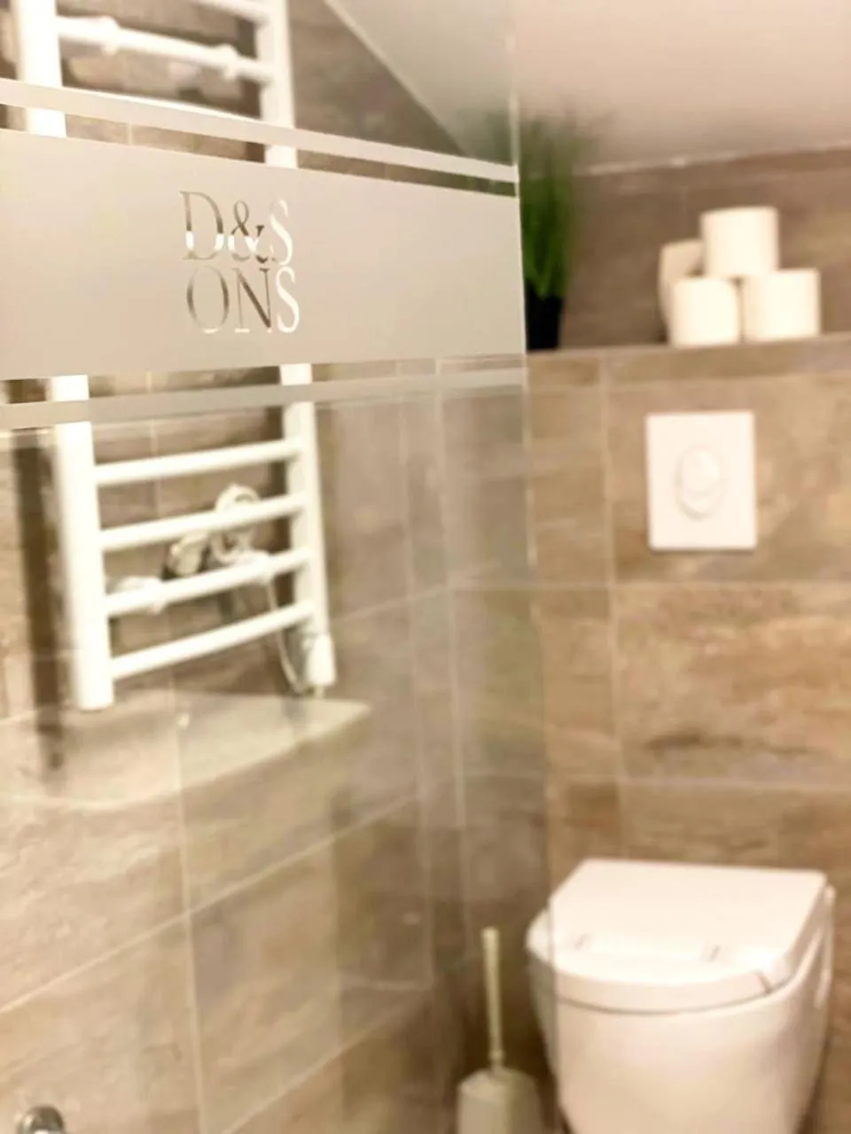 Property logo or sign in D & Sons Apartments