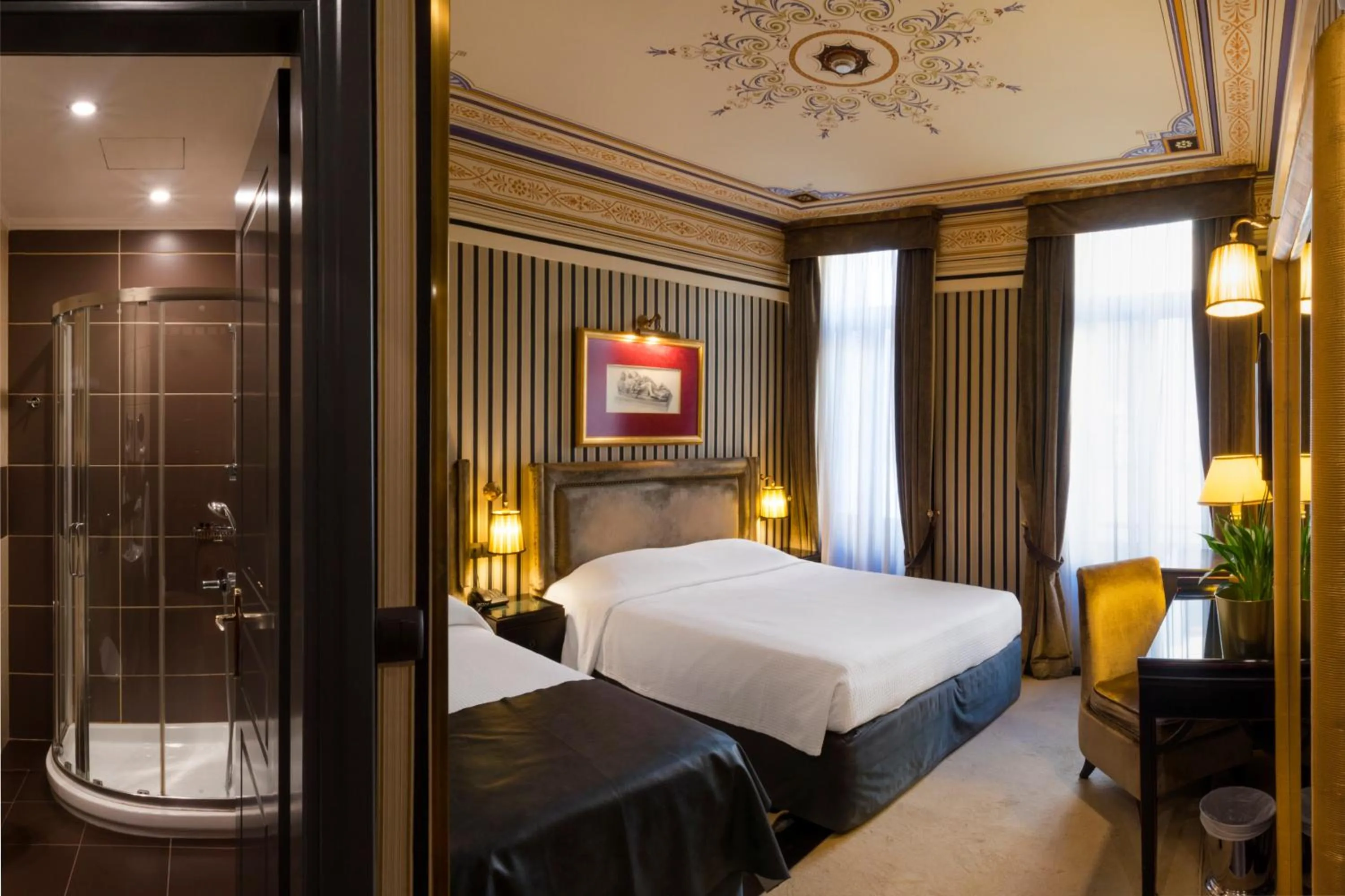 Bed in Maison Grecque Hotel Extraordinaire