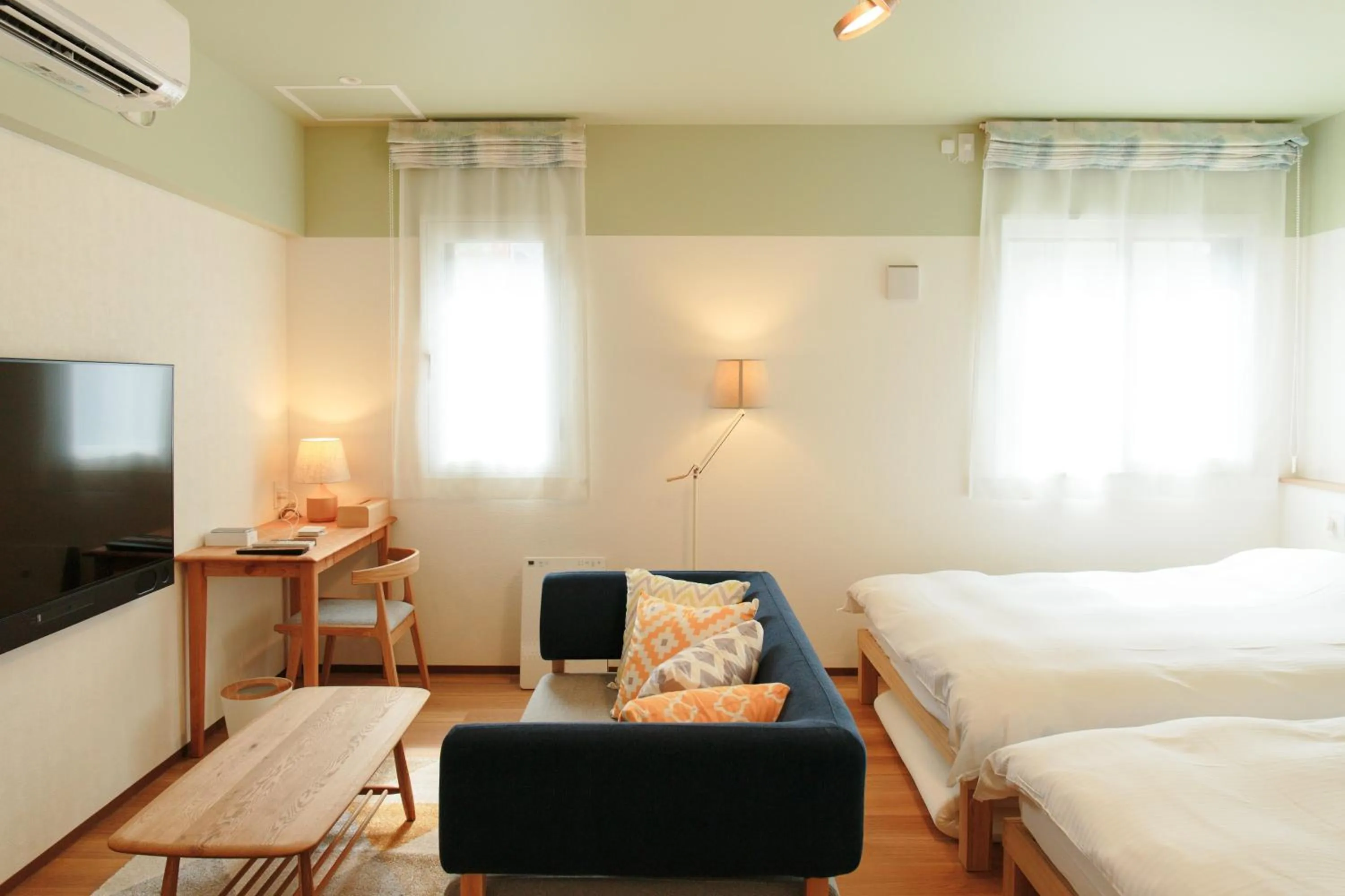 Living room, Bed in Hotel Potmum Sapporo