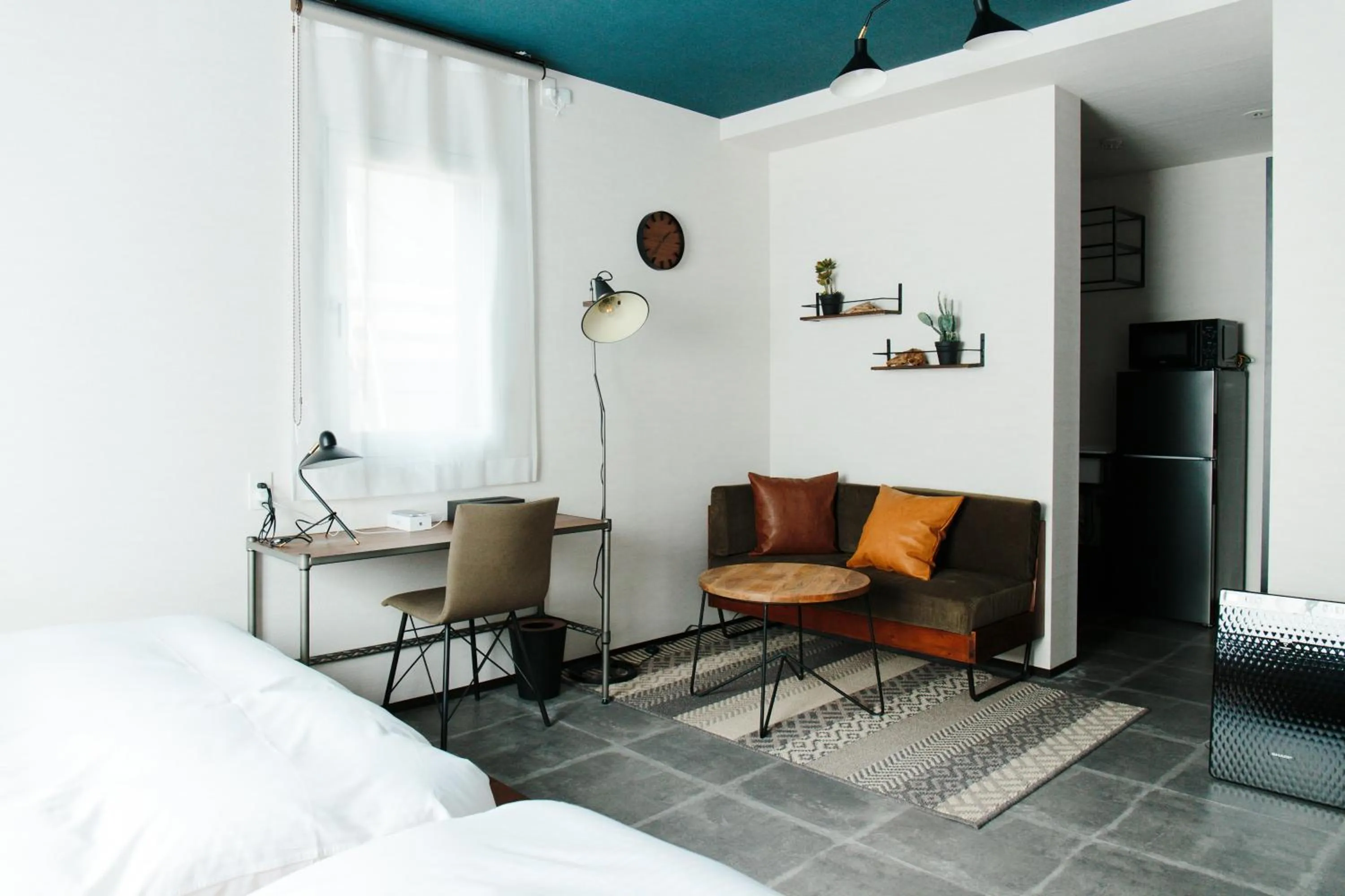 Living room, Bed in Hotel Potmum Sapporo