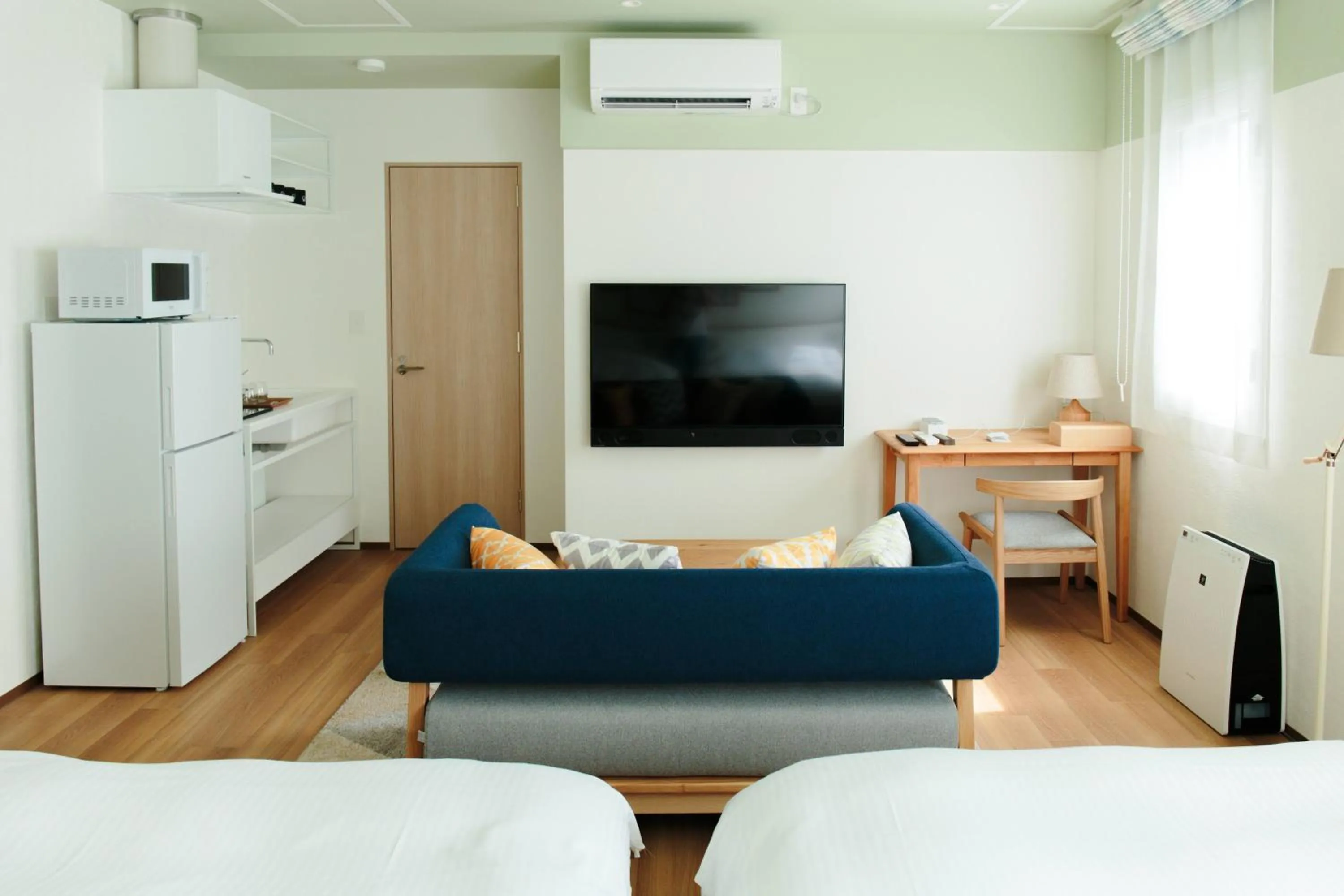 Kitchen or kitchenette, Bed in Hotel Potmum Sapporo